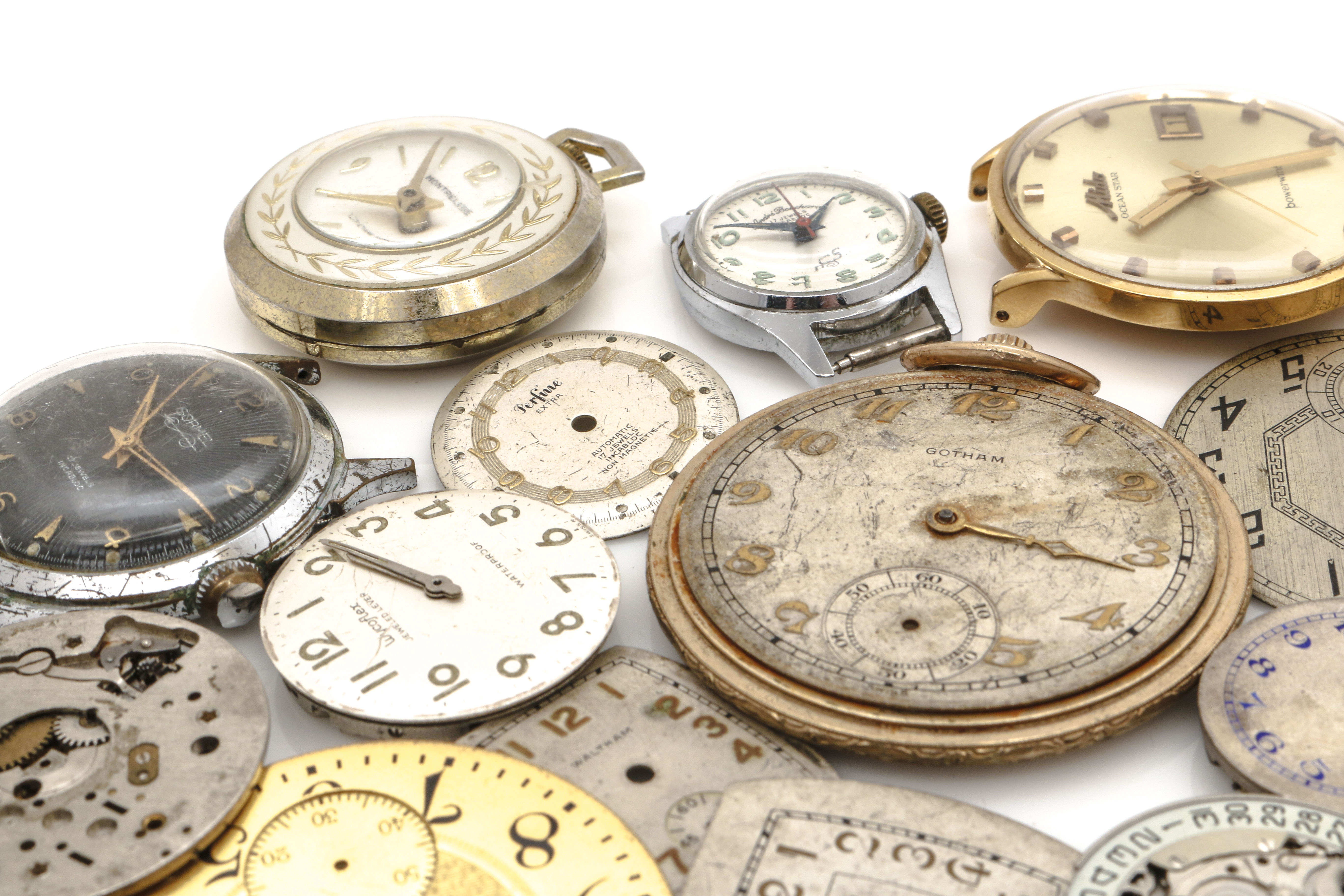 Assortment of Watch Movements, Dials, Cases, and Parts