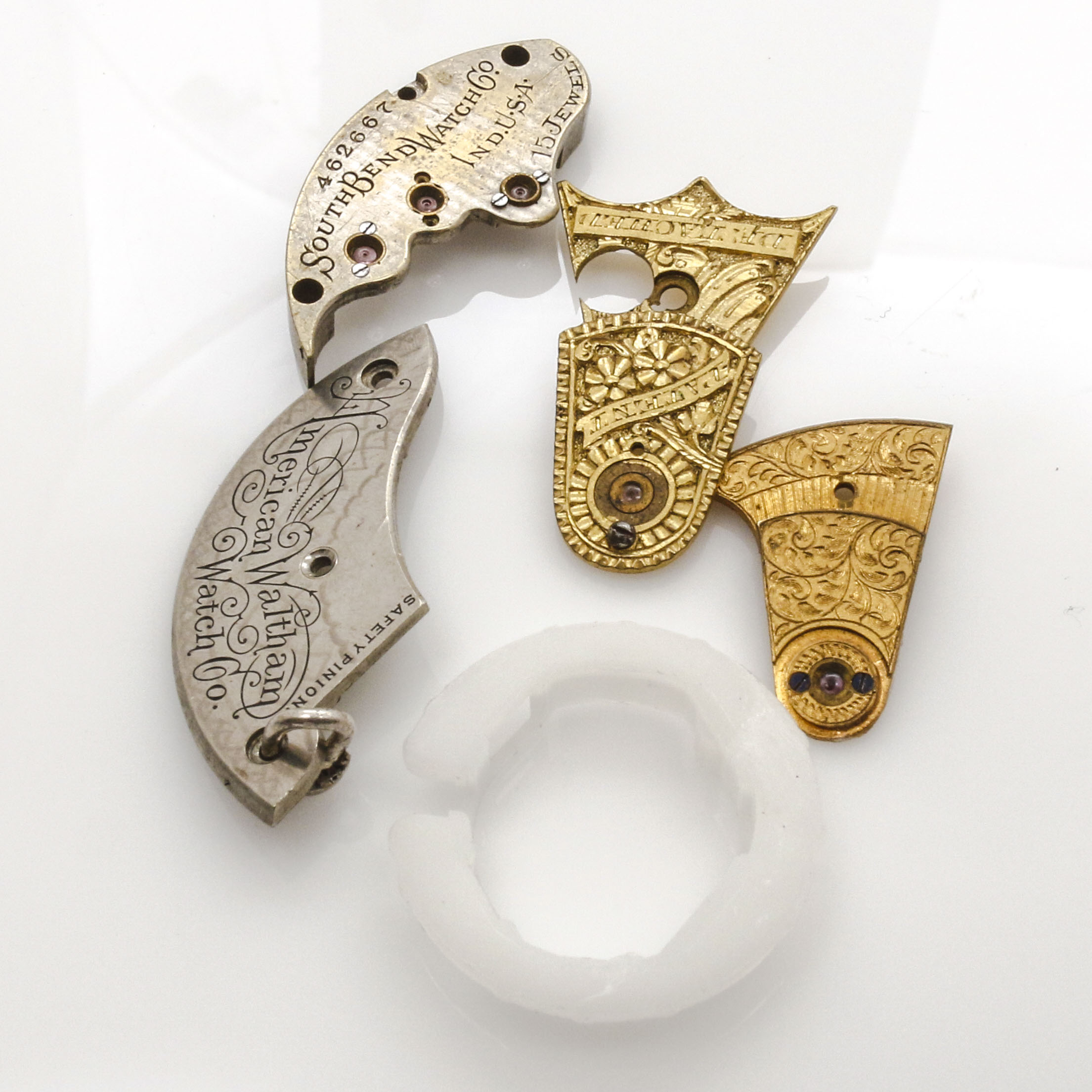 Assortment of Watch Movements, Dials, Cases, and Parts