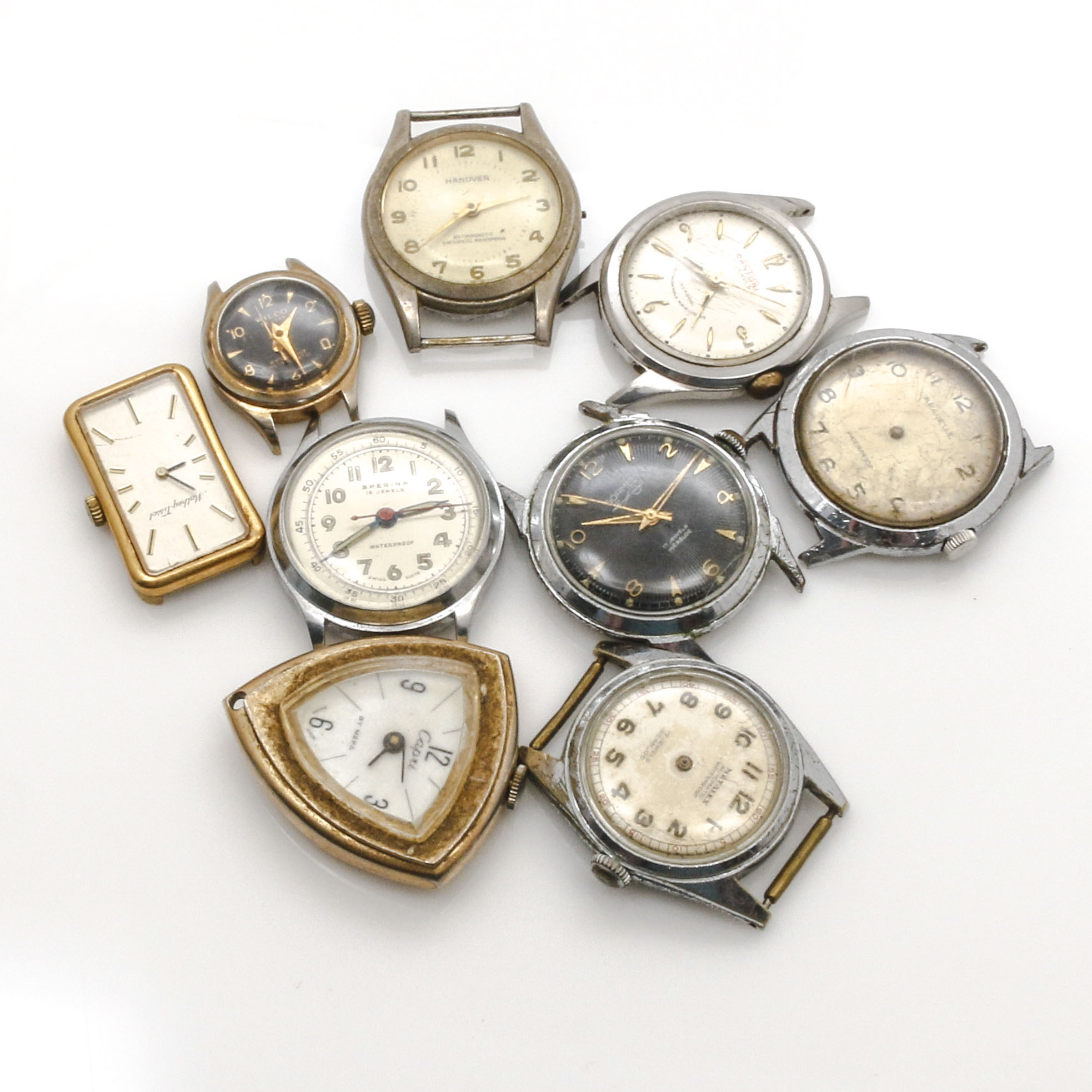 Assortment of Watch Movements, Dials, Cases, and Parts