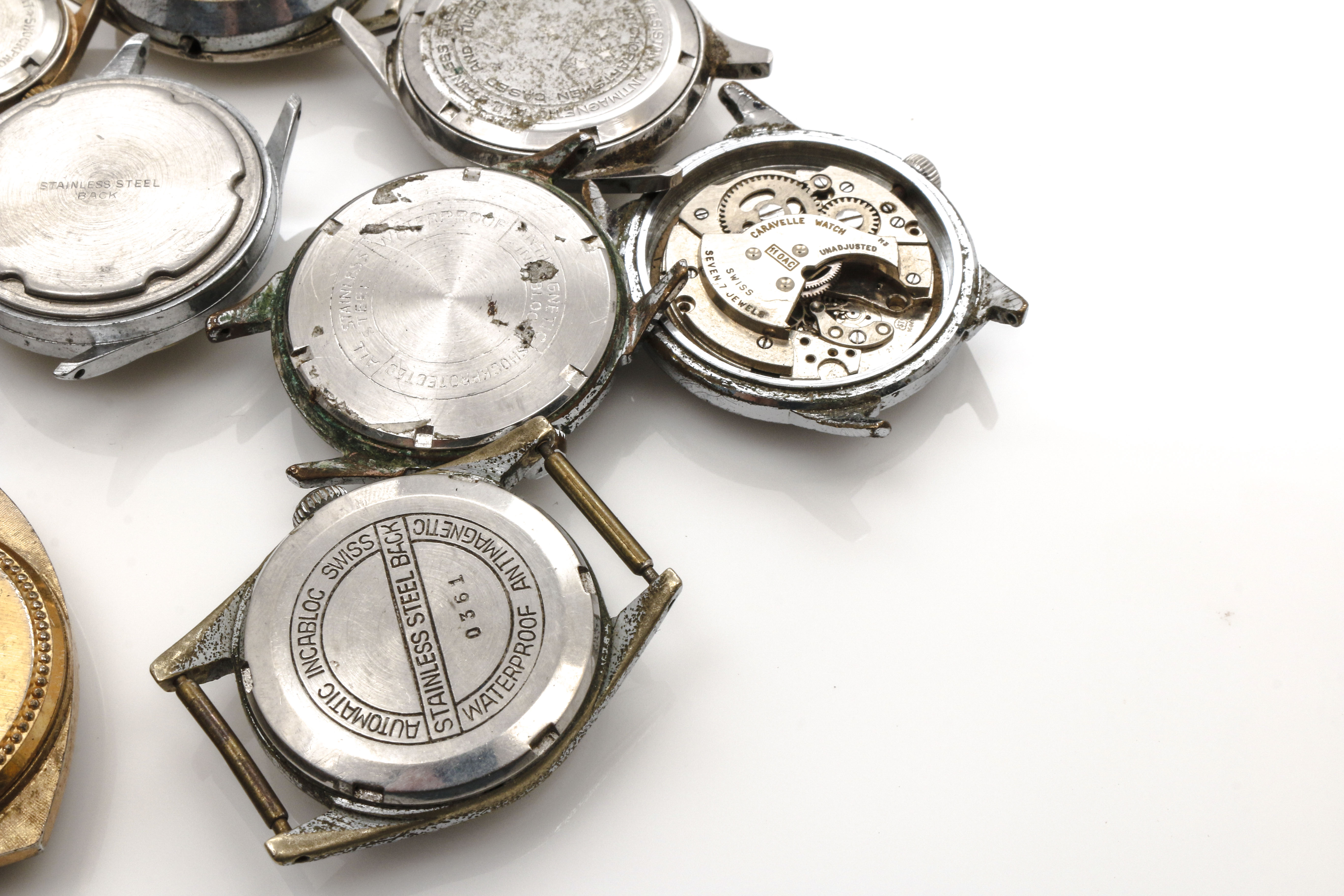 Assortment of Watch Movements, Dials, Cases, and Parts