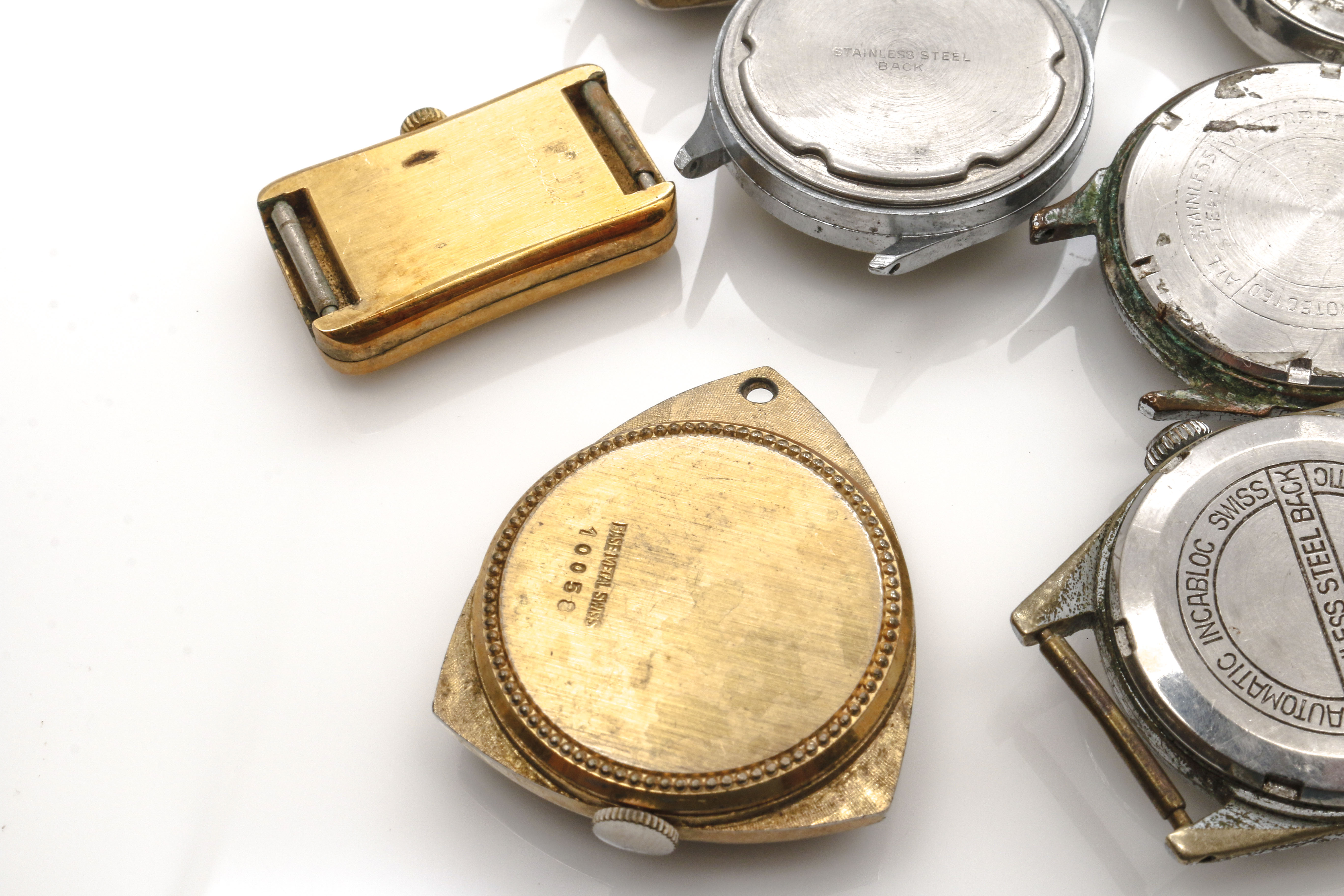 Assortment of Watch Movements, Dials, Cases, and Parts