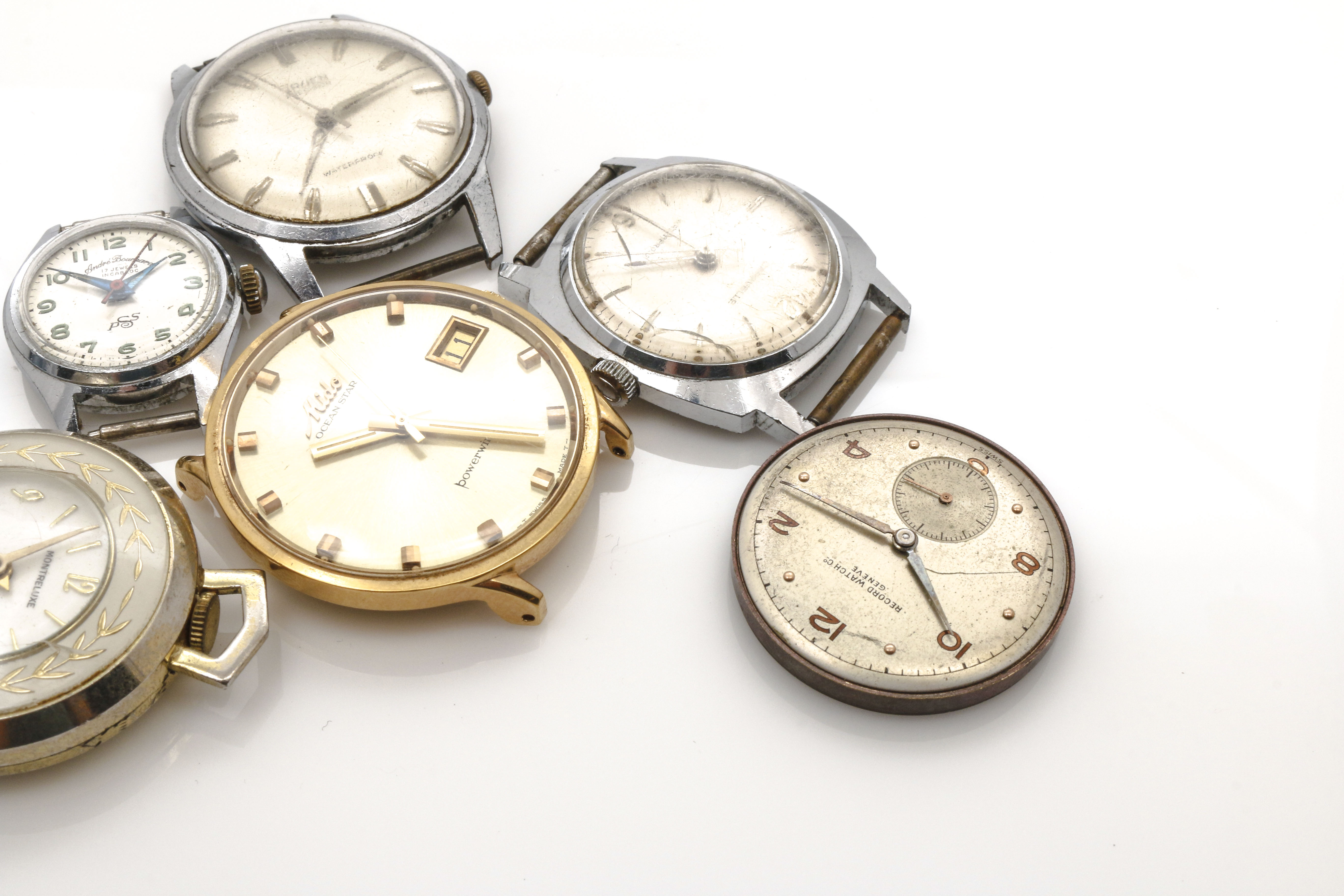 Assortment of Watch Movements, Dials, Cases, and Parts