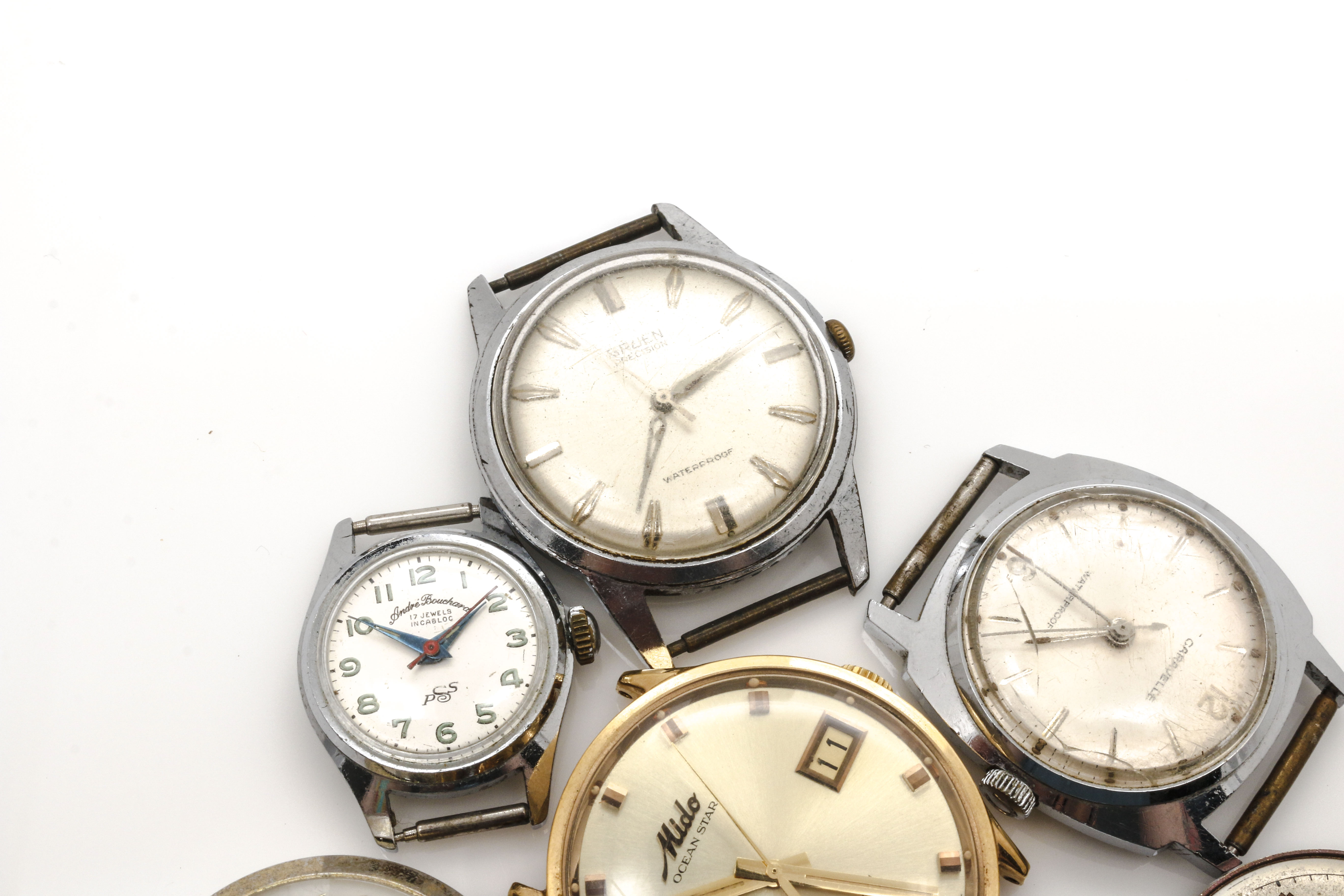 Assortment of Watch Movements, Dials, Cases, and Parts