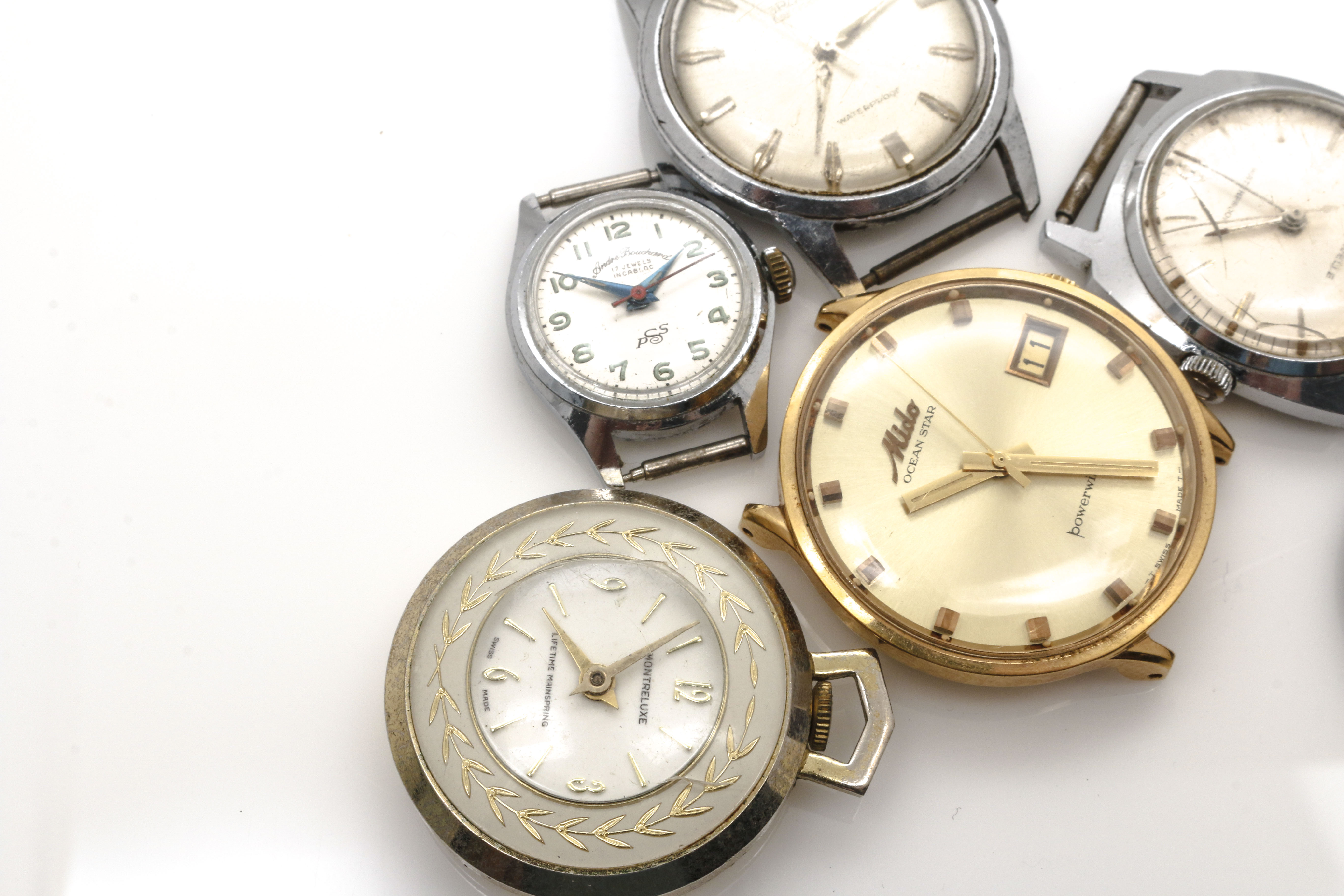 Assortment of Watch Movements, Dials, Cases, and Parts