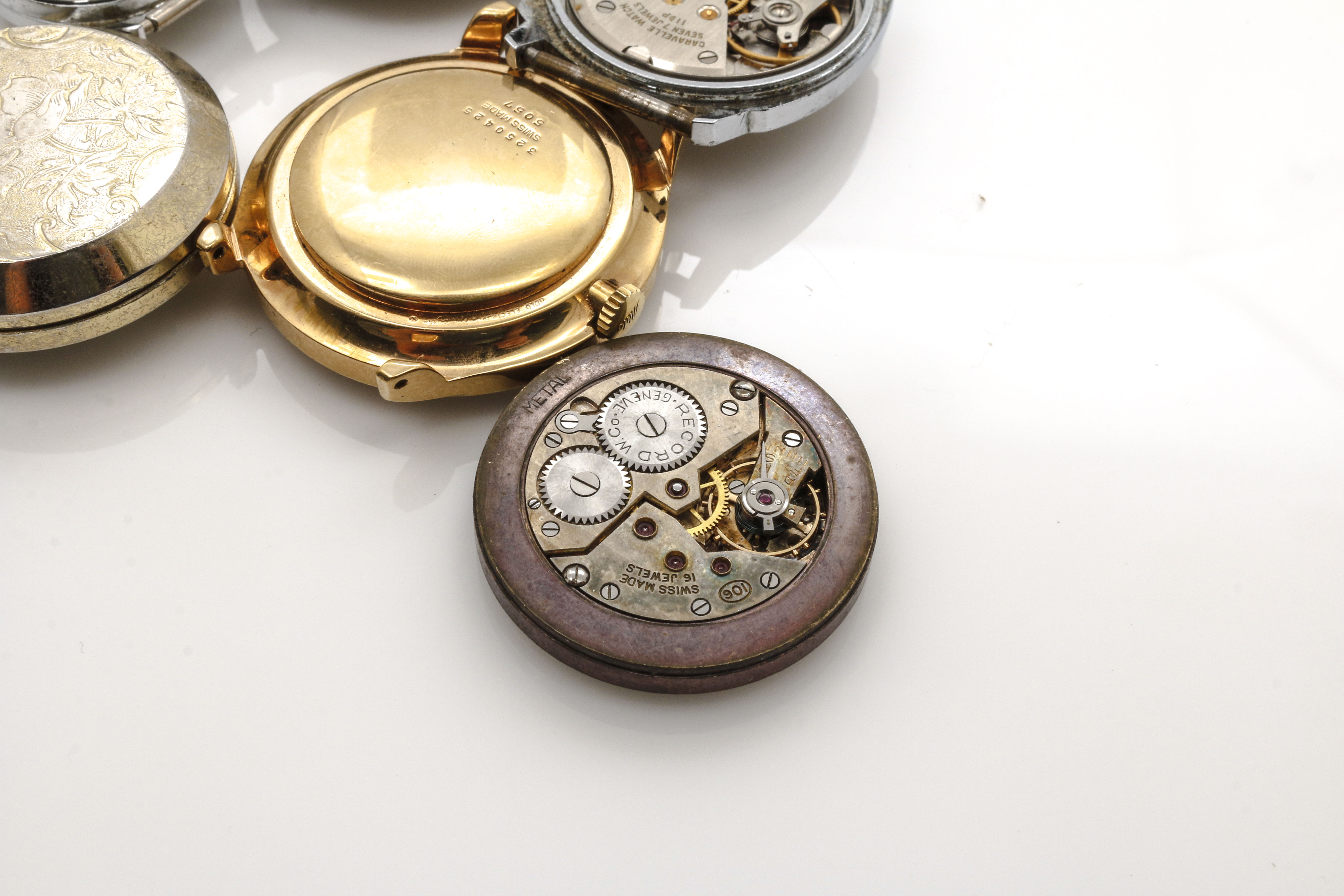 Assortment of Watch Movements, Dials, Cases, and Parts