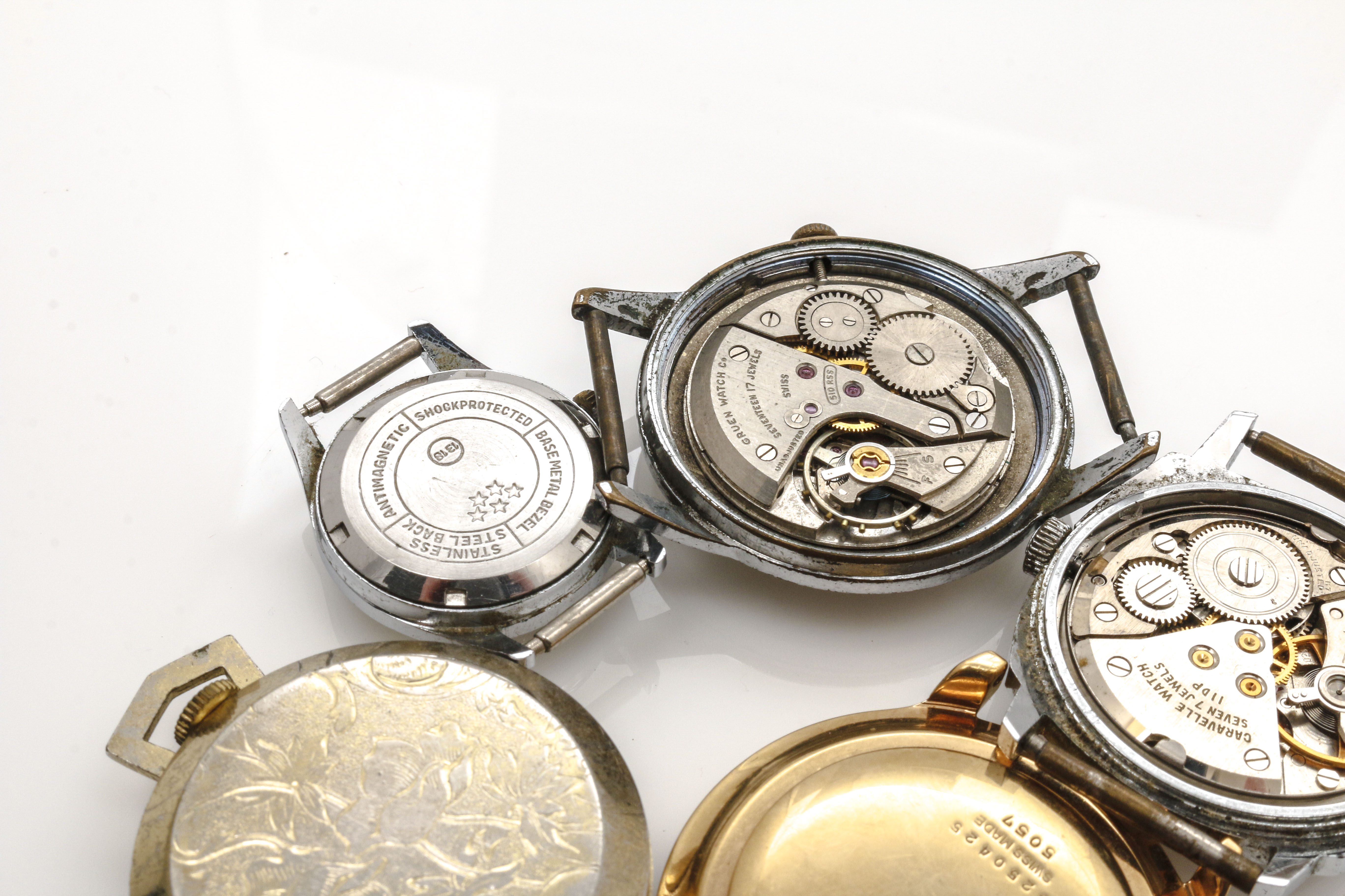 Assortment of Watch Movements, Dials, Cases, and Parts