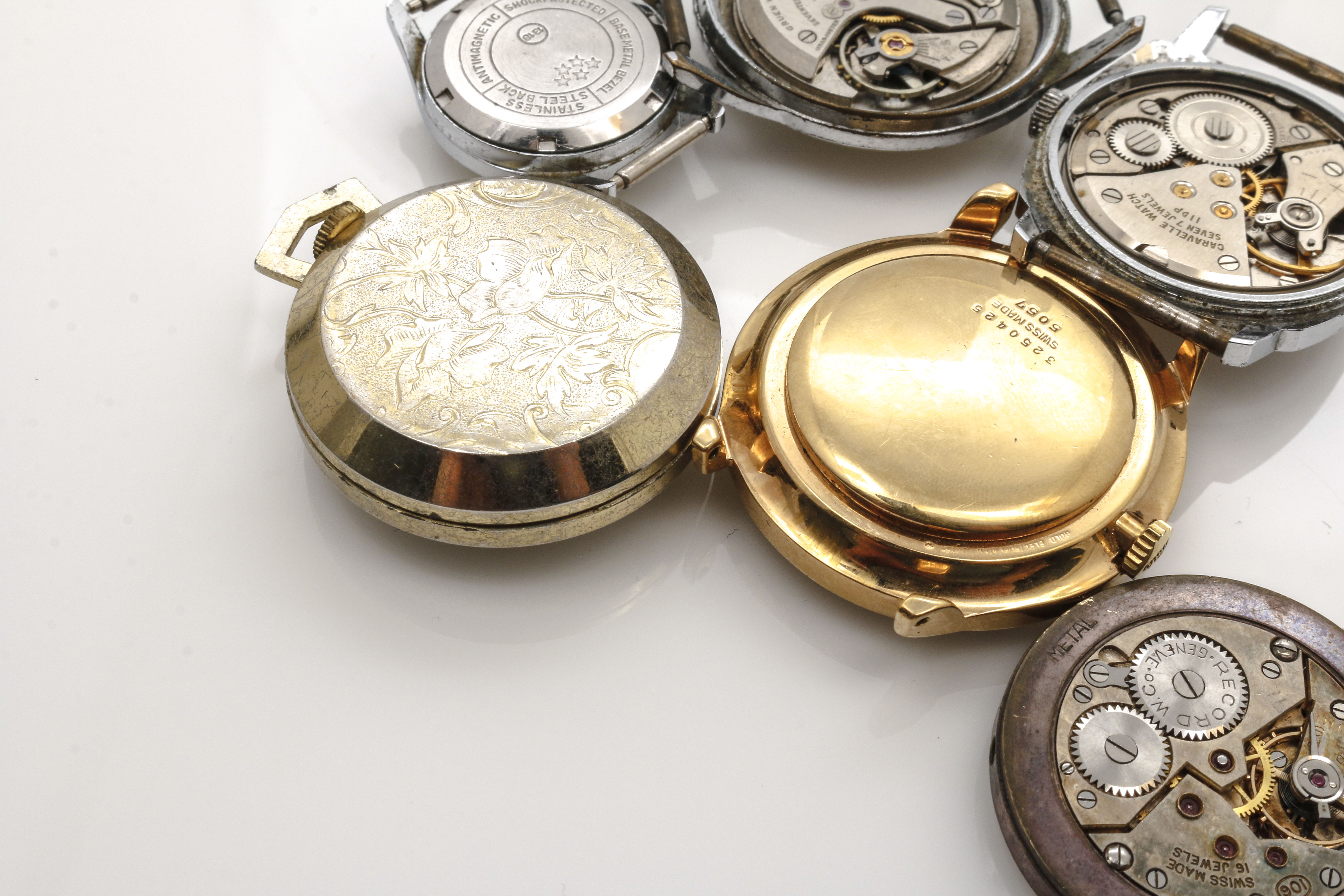 Assortment of Watch Movements, Dials, Cases, and Parts