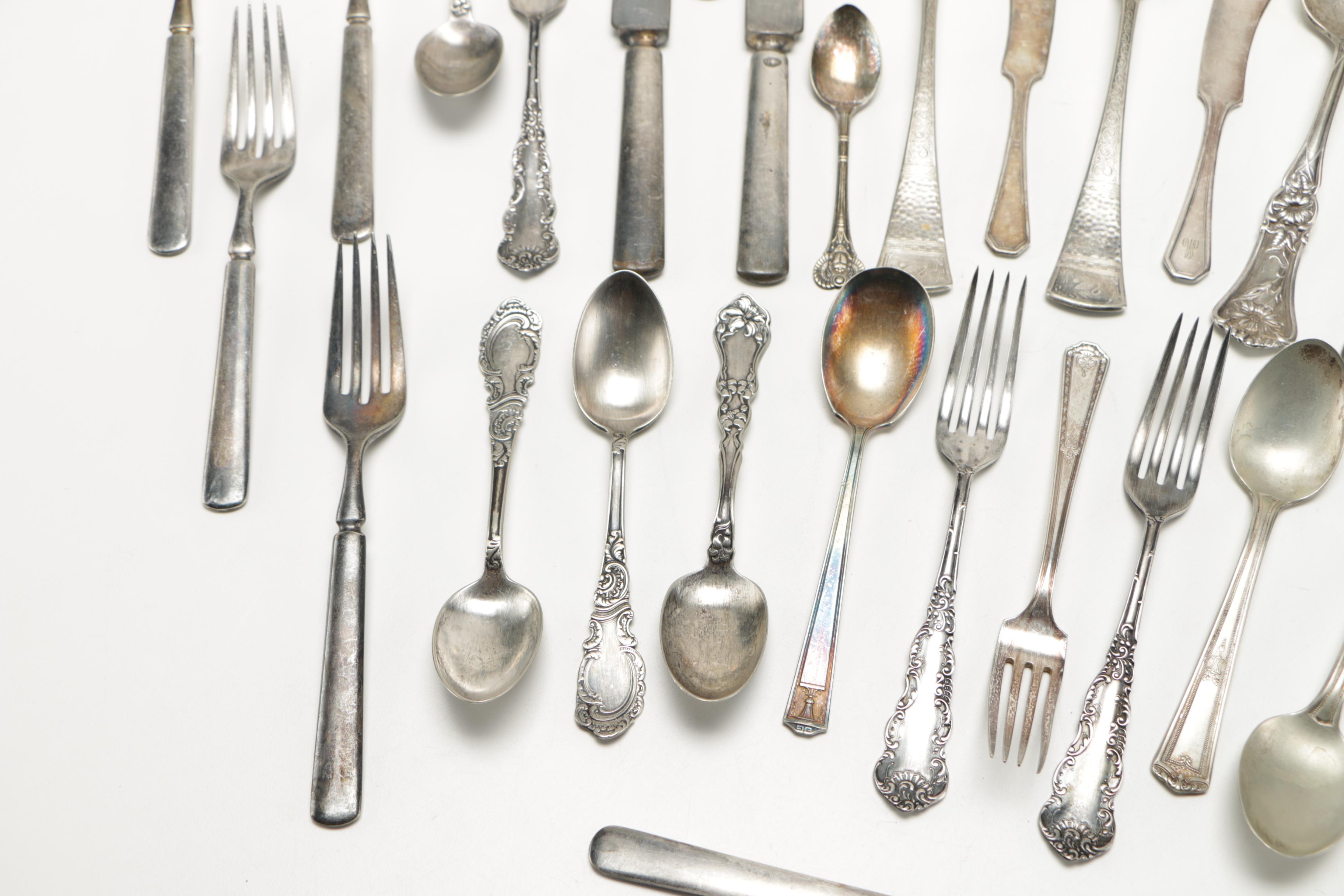 Assorted Silver Plate Flatware Featuring C.D Peacock