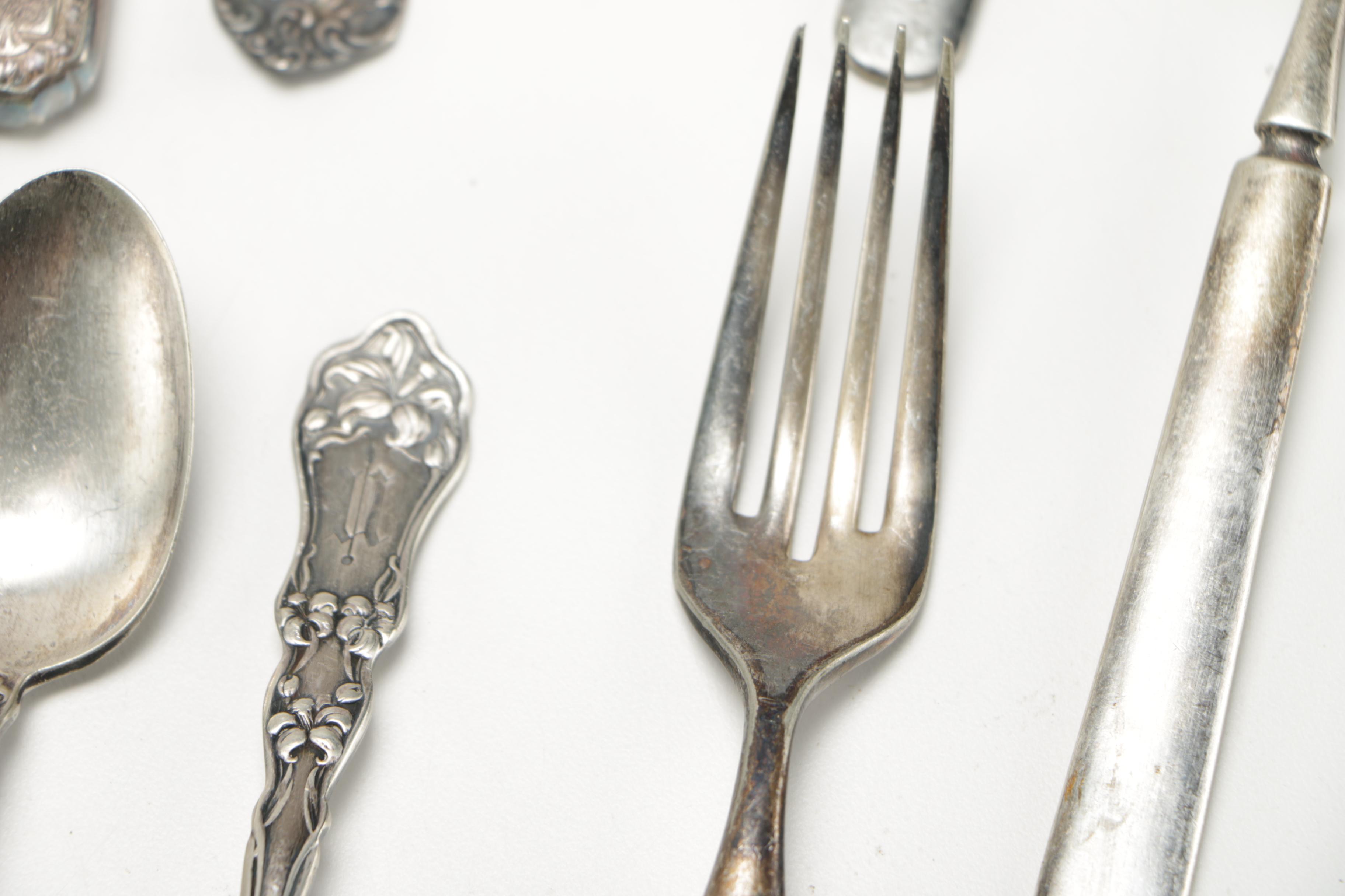 Assorted Silver Plate Flatware Featuring C.D Peacock