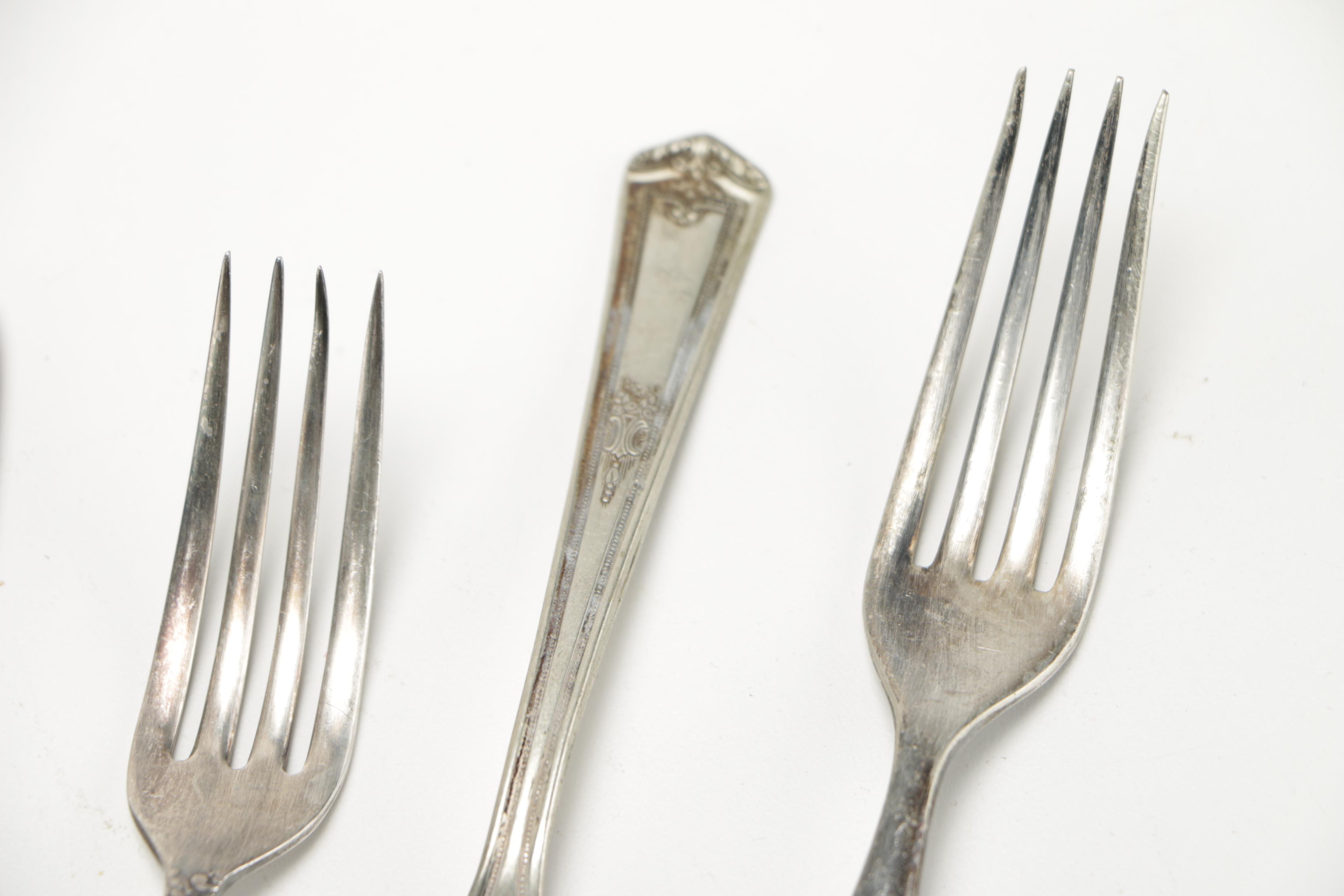 Assorted Silver Plate Flatware Featuring C.D Peacock
