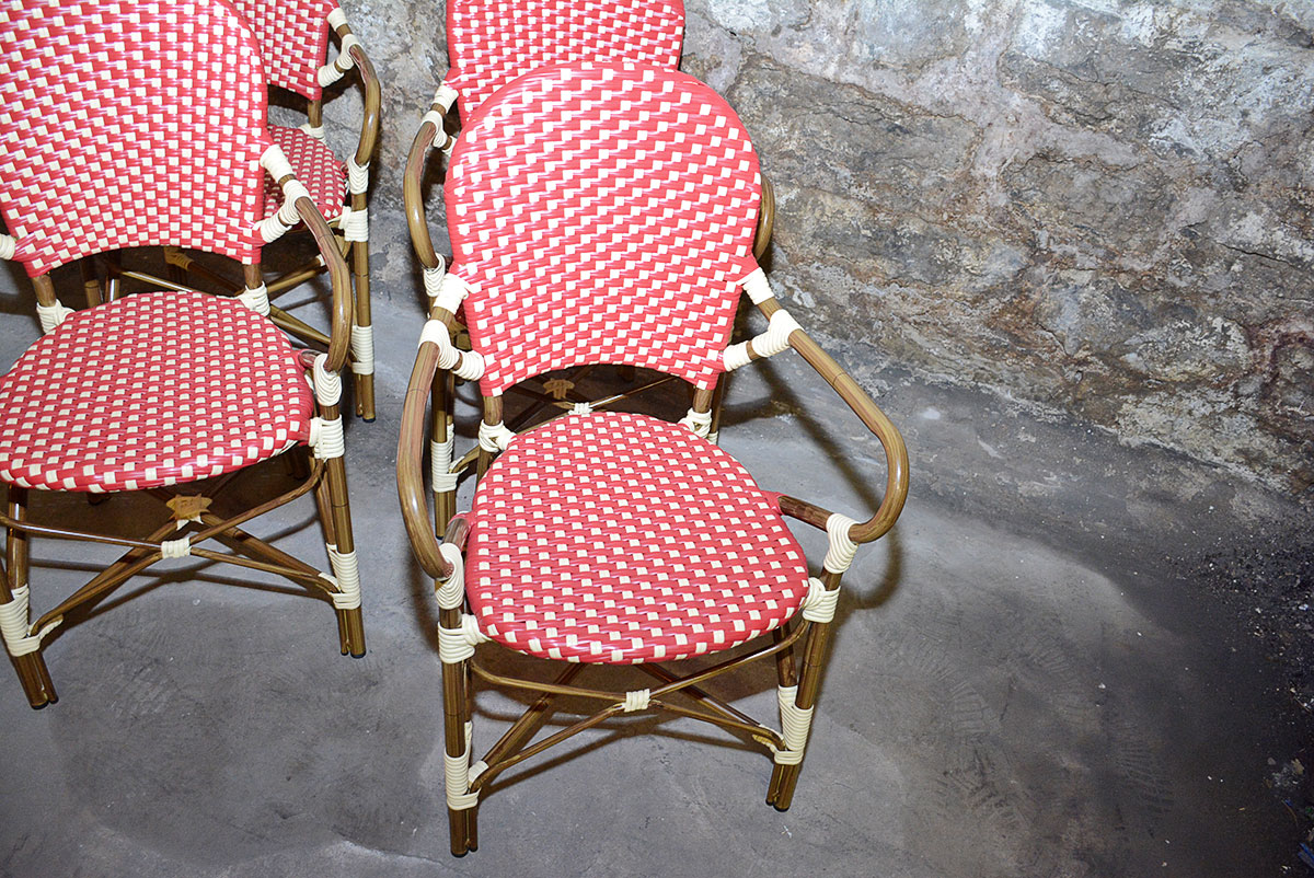 Red and White Woven Rattan Chairs