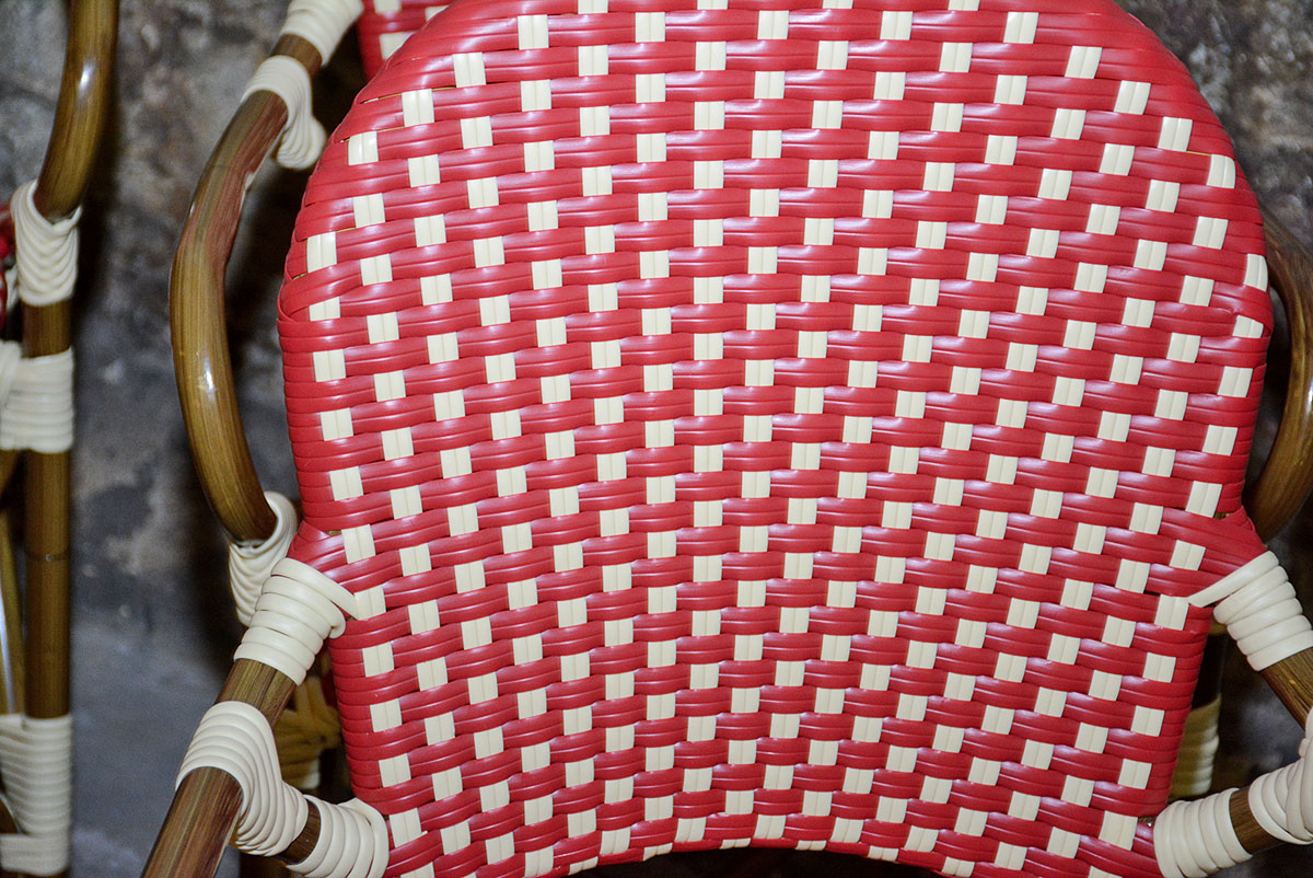 Red and White Woven Rattan Chairs