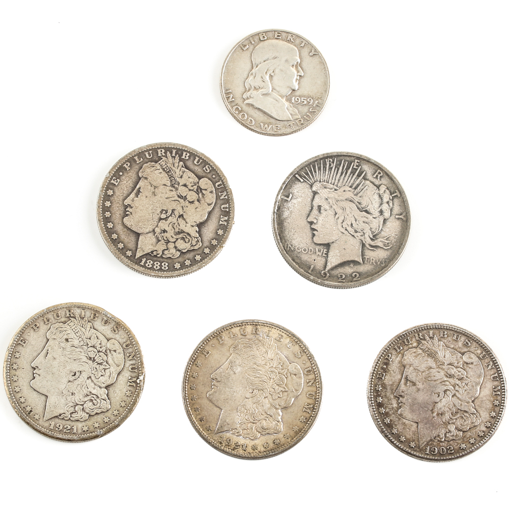 Five U.S. Silver Dollars and a Silver Half Dollar