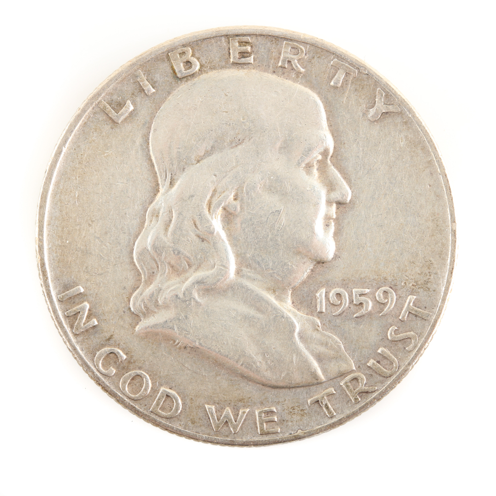 Five U.S. Silver Dollars and a Silver Half Dollar