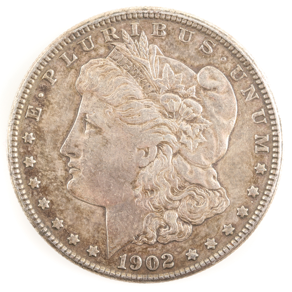 Five U.S. Silver Dollars and a Silver Half Dollar