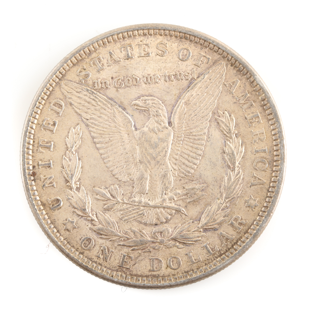 Five U.S. Silver Dollars and a Silver Half Dollar