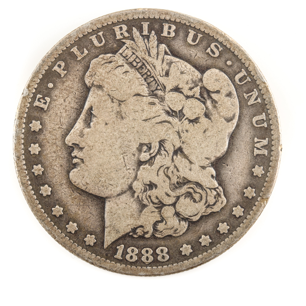 Five U.S. Silver Dollars and a Silver Half Dollar