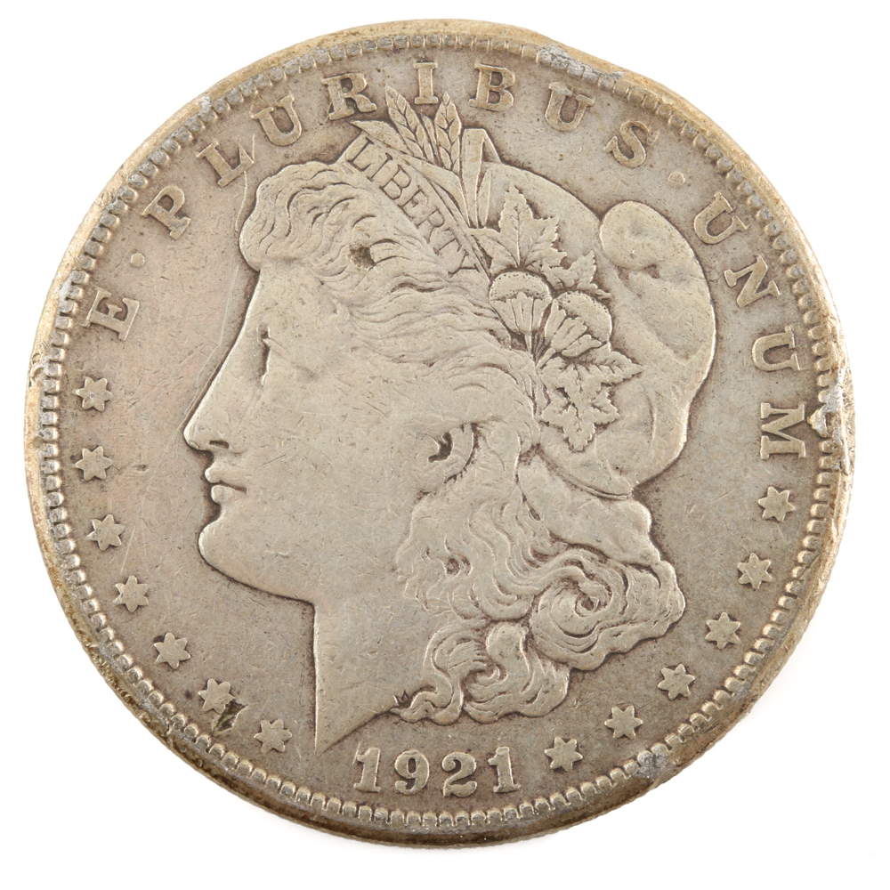 Five U.S. Silver Dollars and a Silver Half Dollar