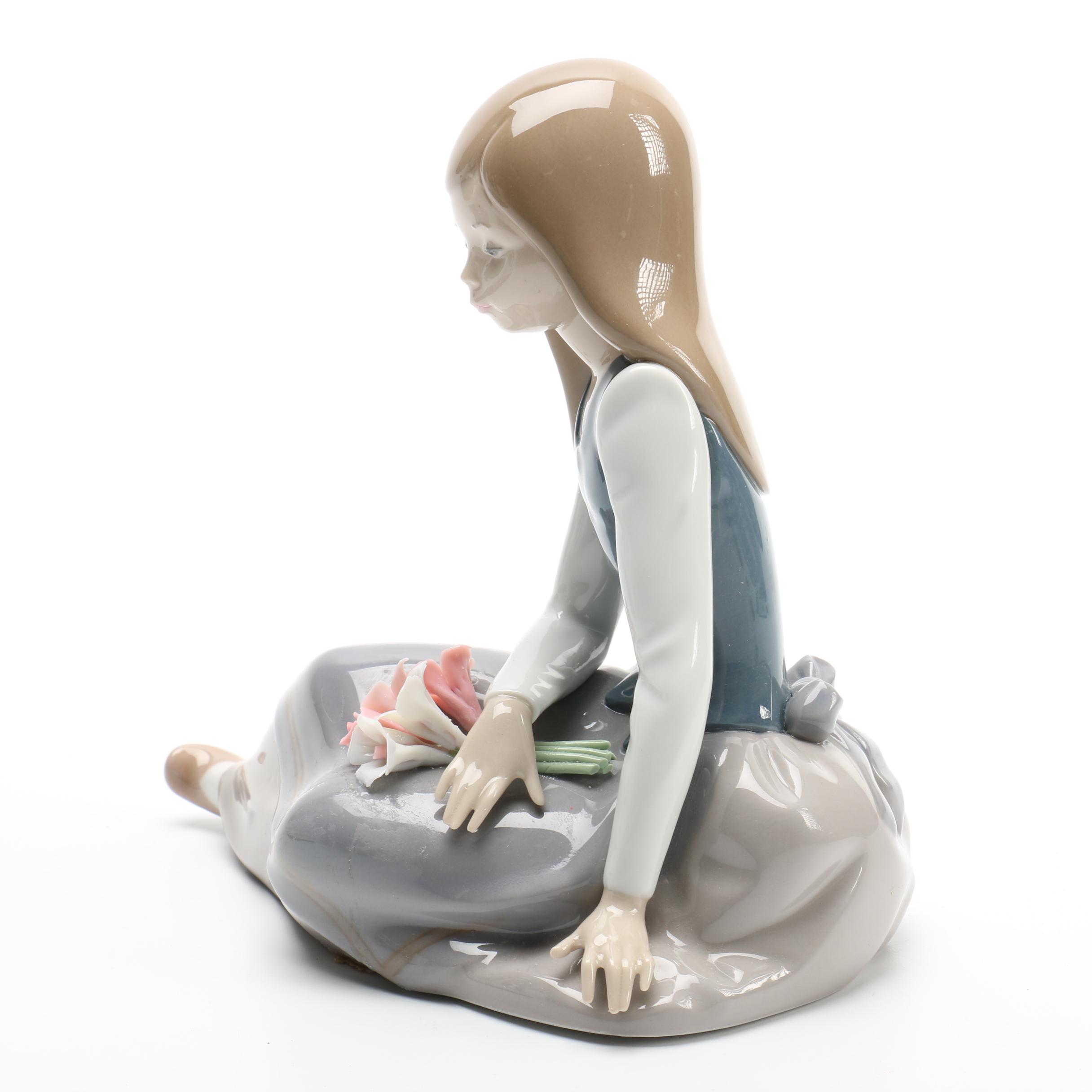Lladro Ceramic Figure of a Girl With Flowers