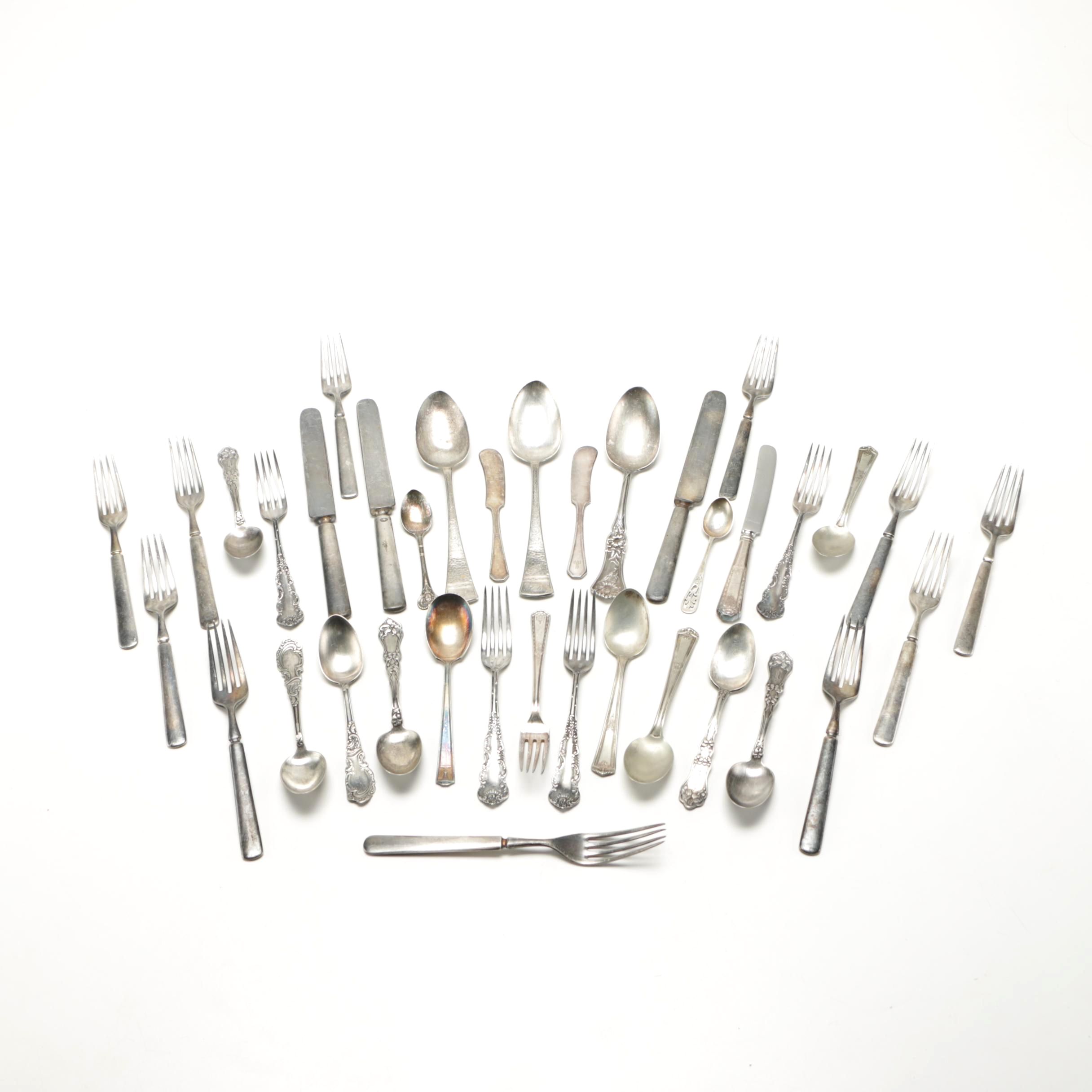 Assorted Silver Plate Flatware Featuring C.D Peacock