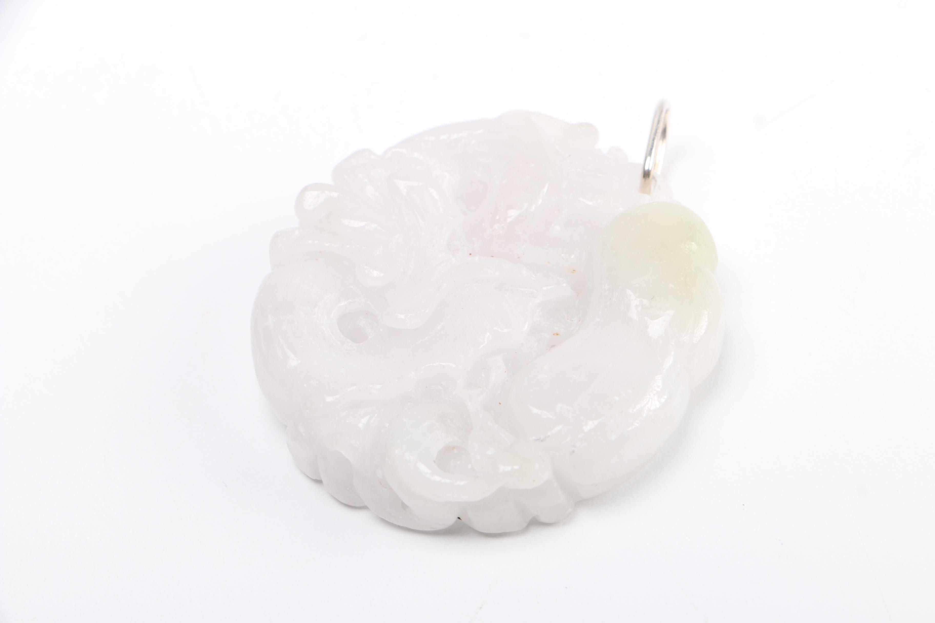 Selection of Pendants Featuring Jadeite and Serpentine