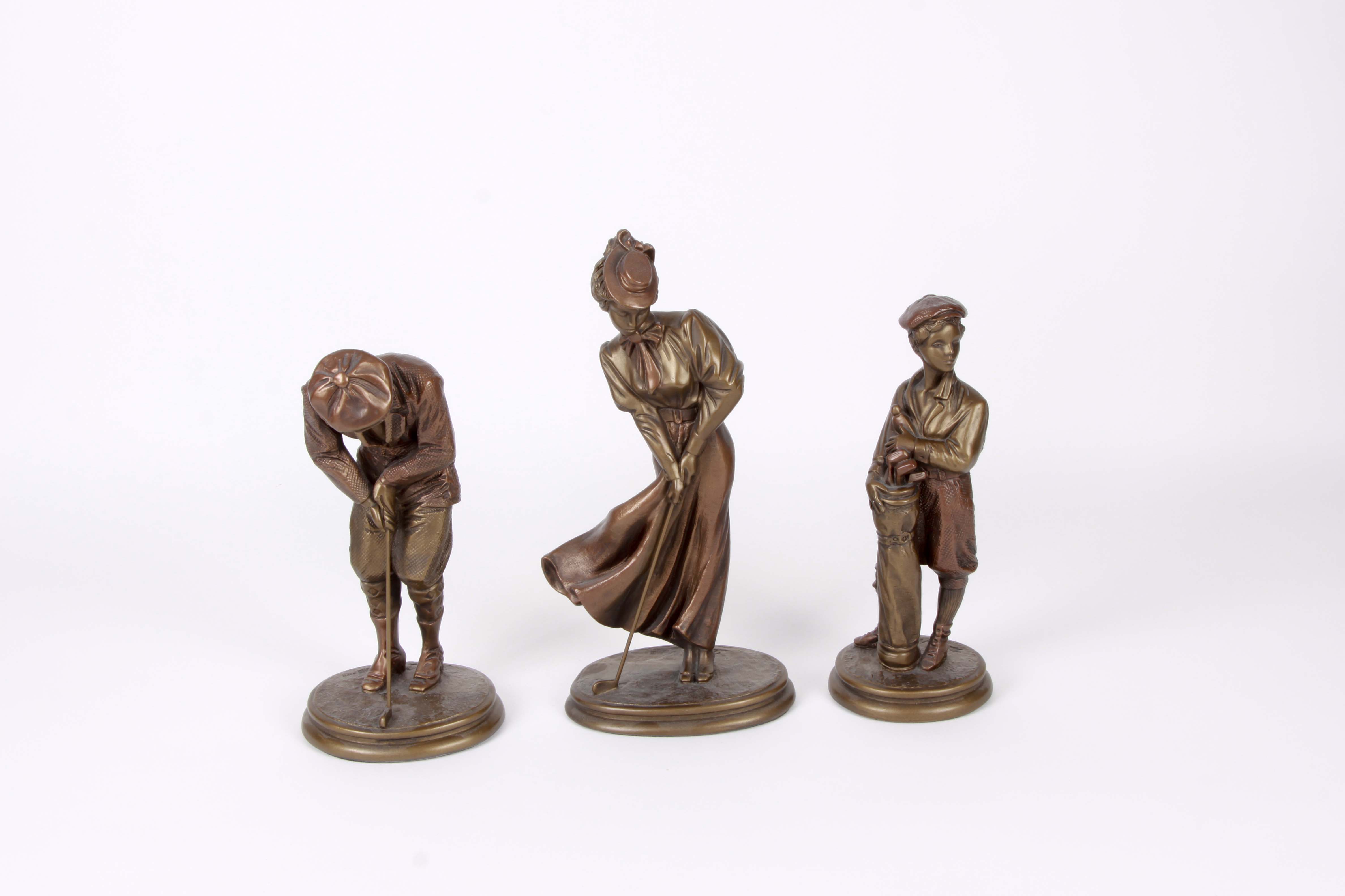 A Group of Golfing Sculptures by Austin Ltd.