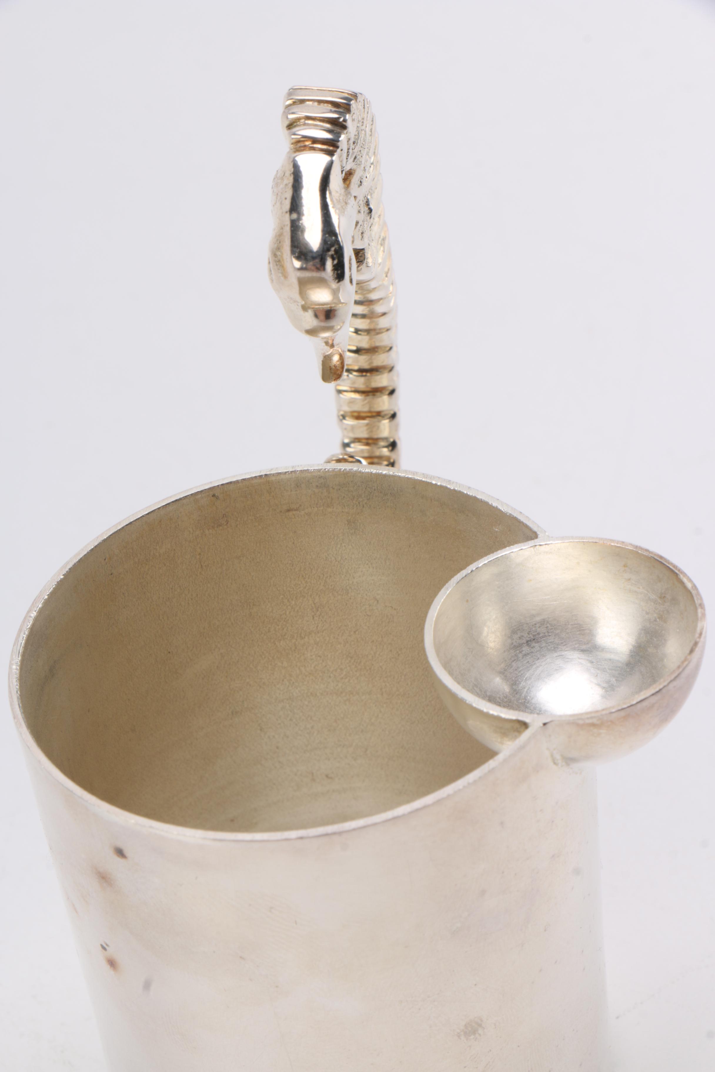 Steel Sea Horse Handled Jugs