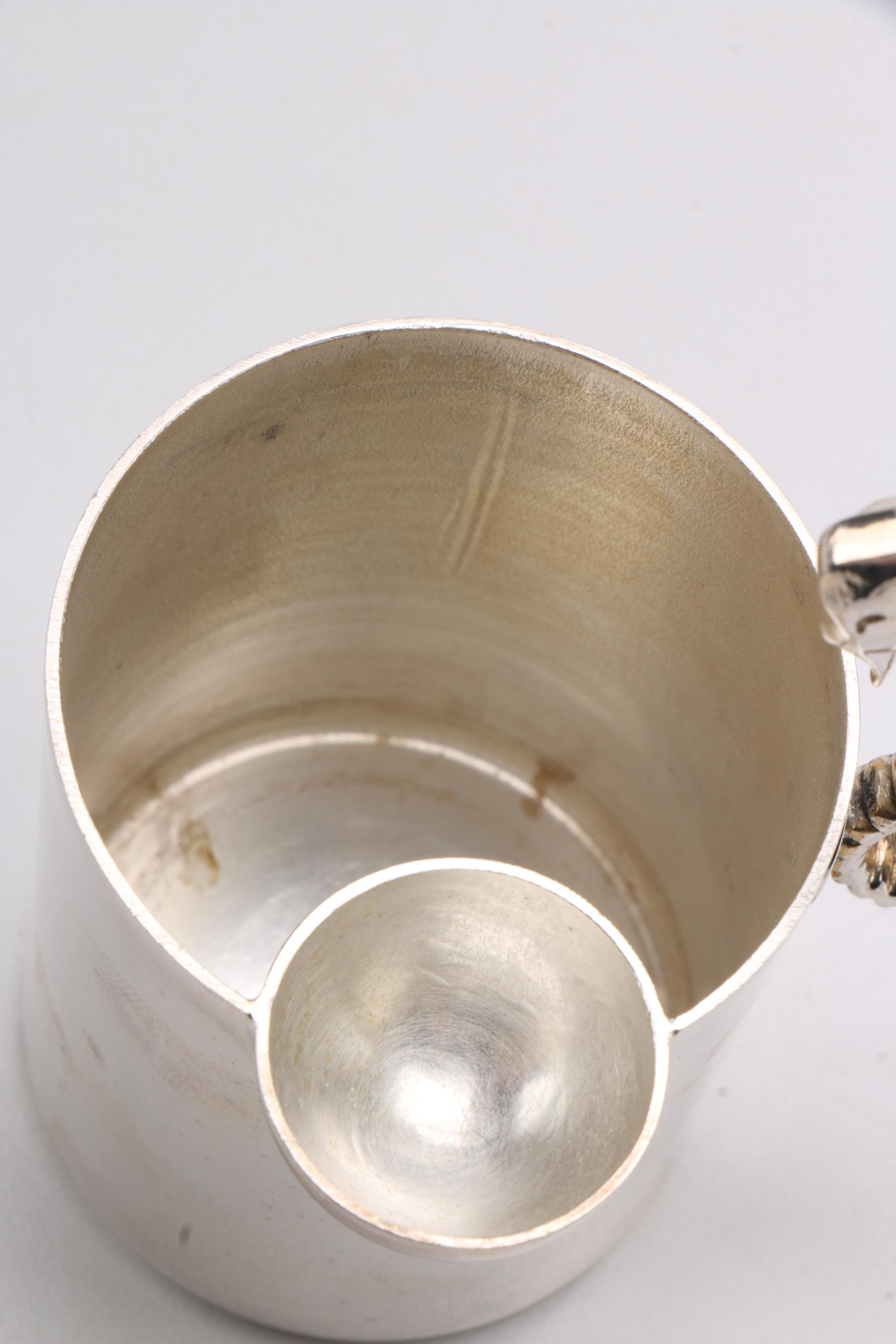 Steel Sea Horse Handled Jugs