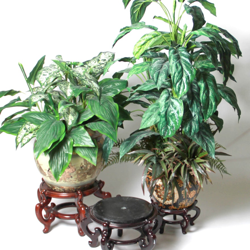 Faux Plants With Decorative Pots and Wooden Stands