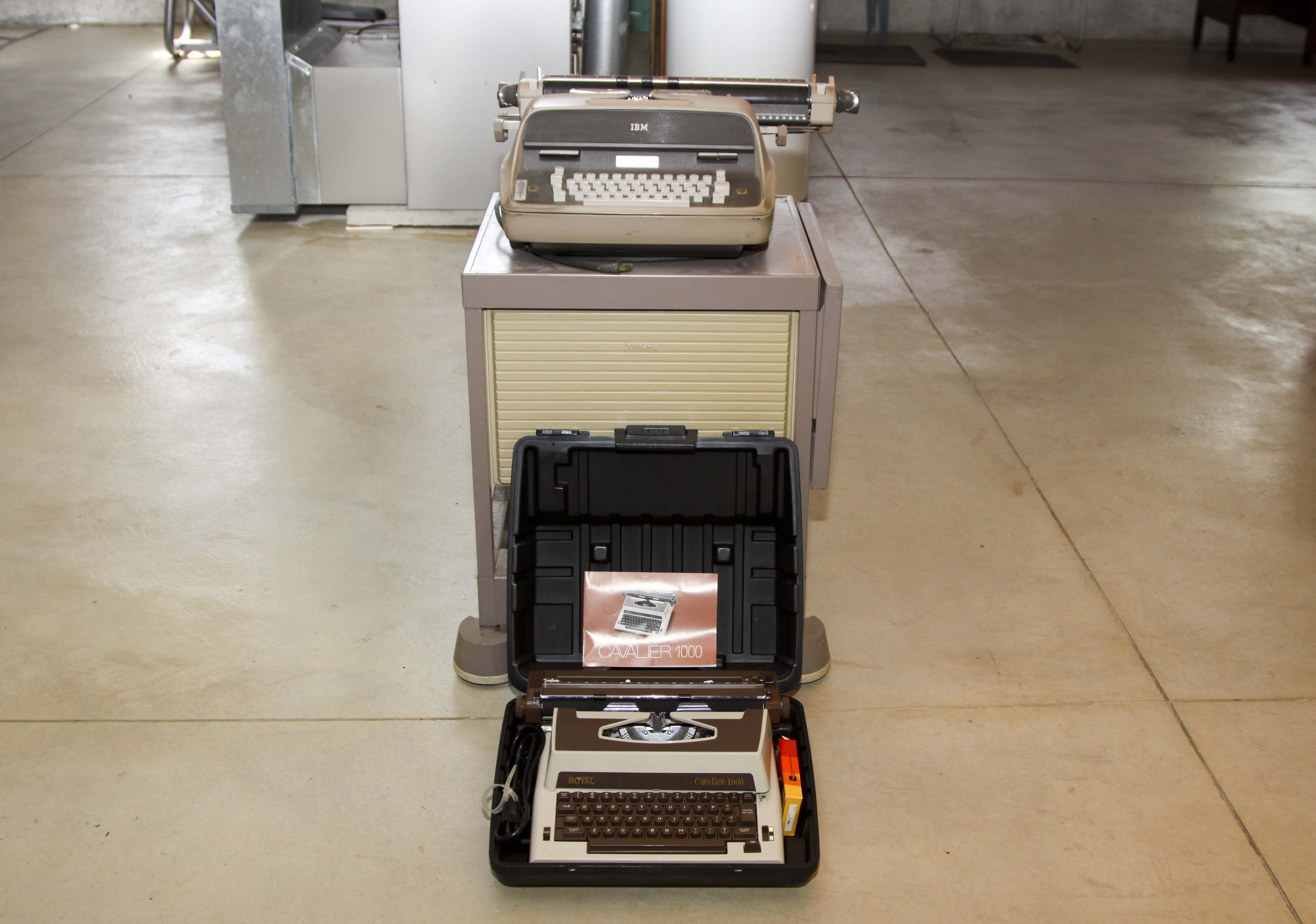 Two Vintage Electric Typewriters With Stand