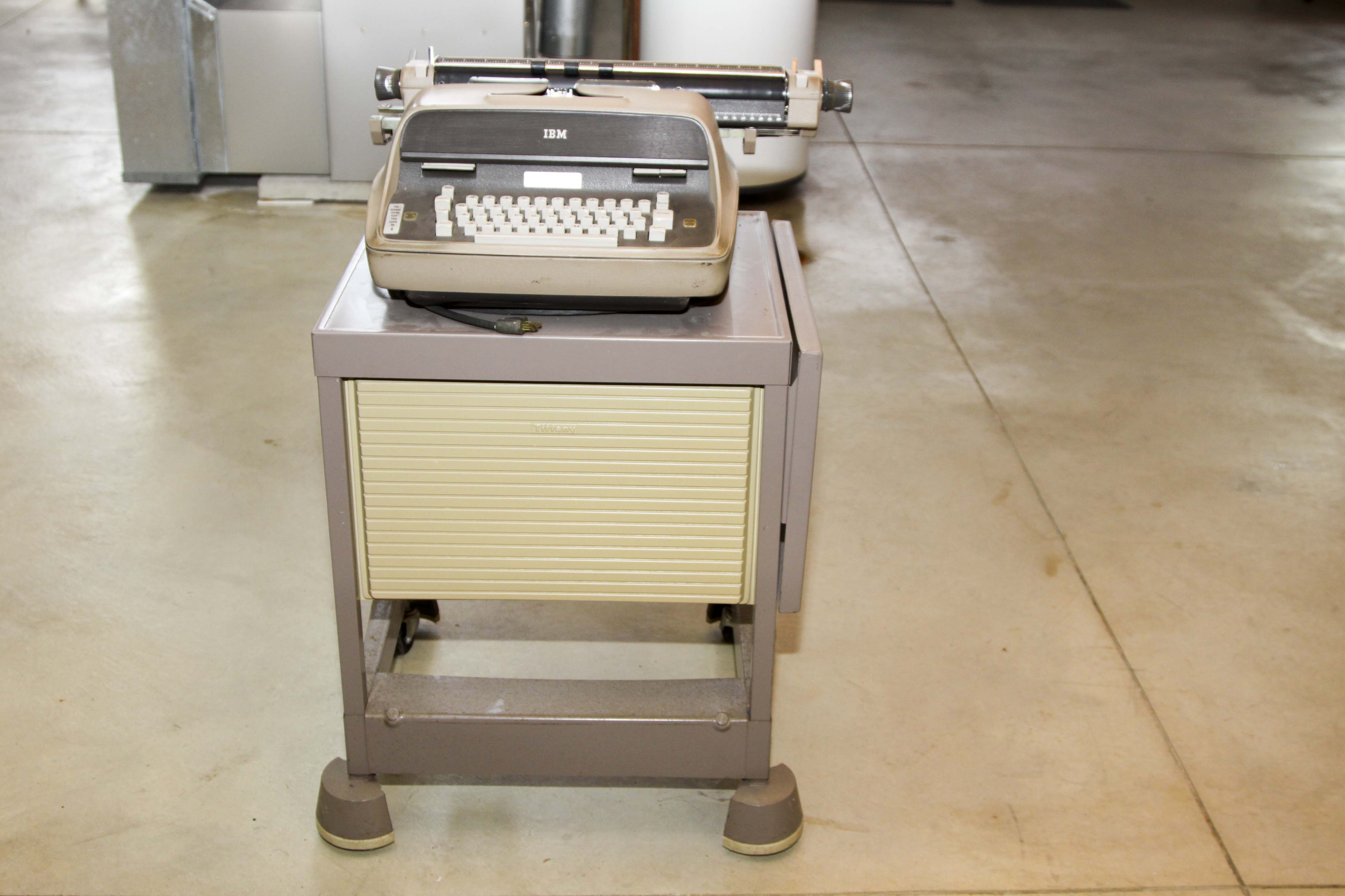 Two Vintage Electric Typewriters With Stand
