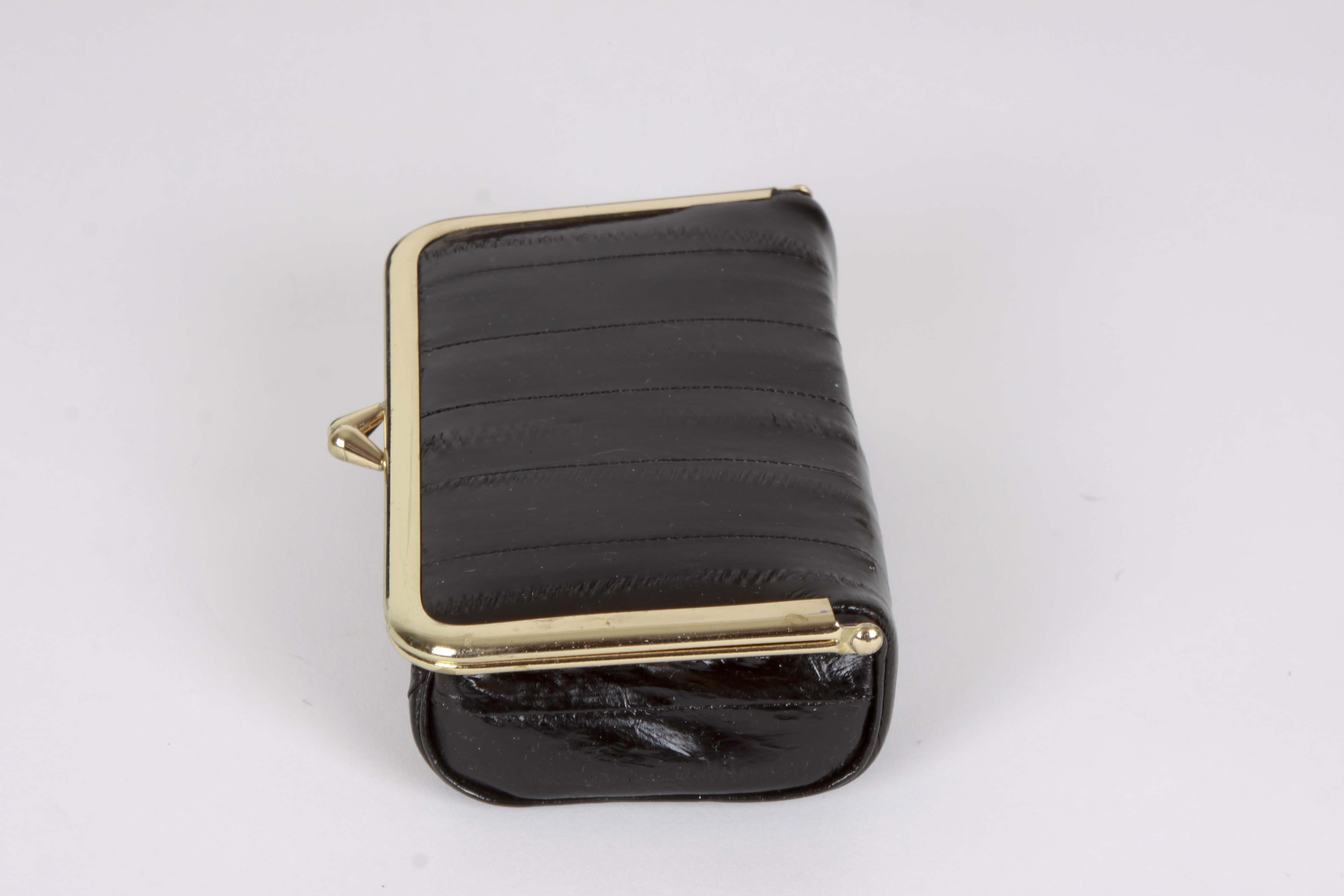 A Collection of Genuine Eel Skin Handbags and Wallets