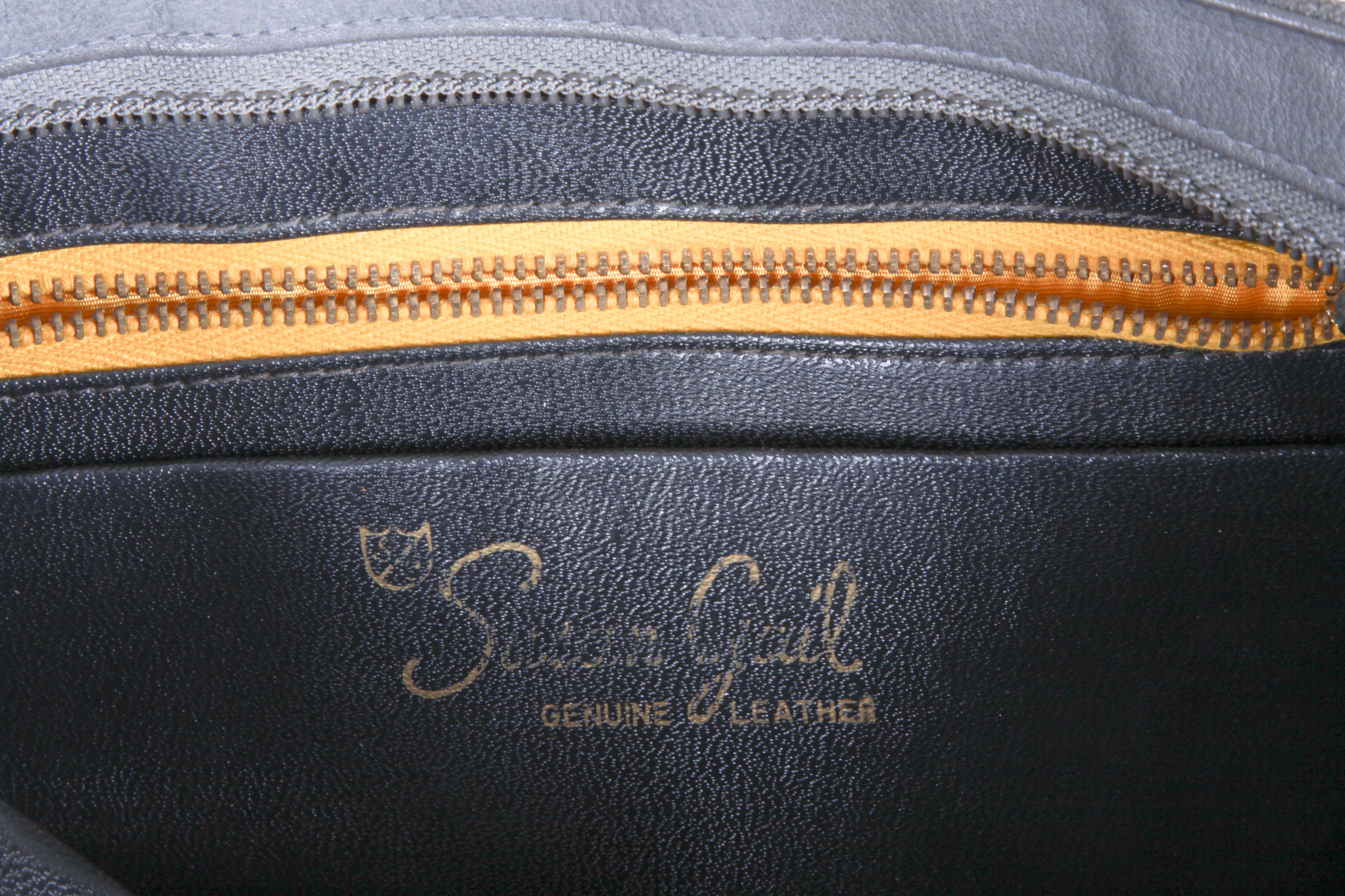 Pairing of Handbags by Susan Gail and Tignanello