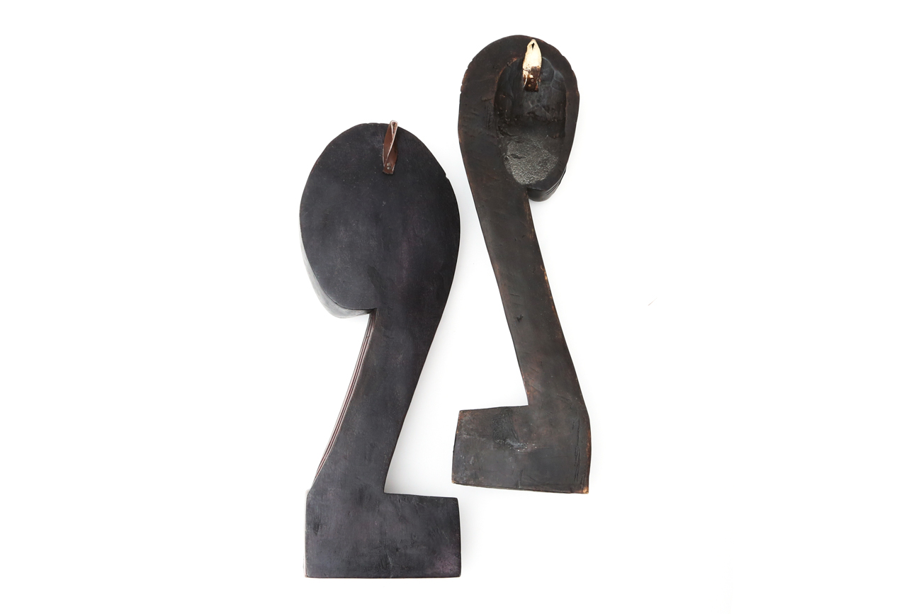 Pair Of Hanging Carved African Busts With Metal Accents