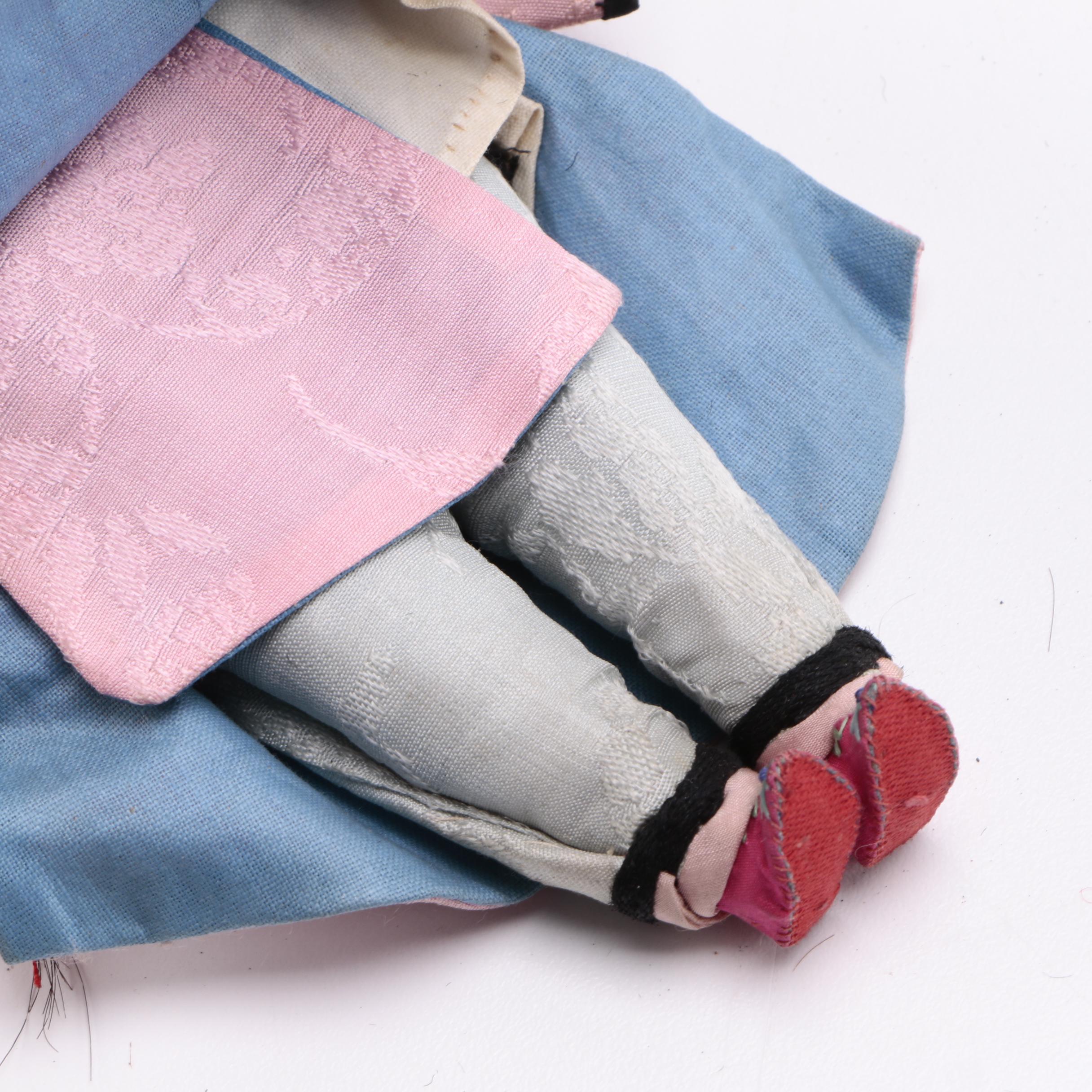 Two Chinese Porcelain Dolls