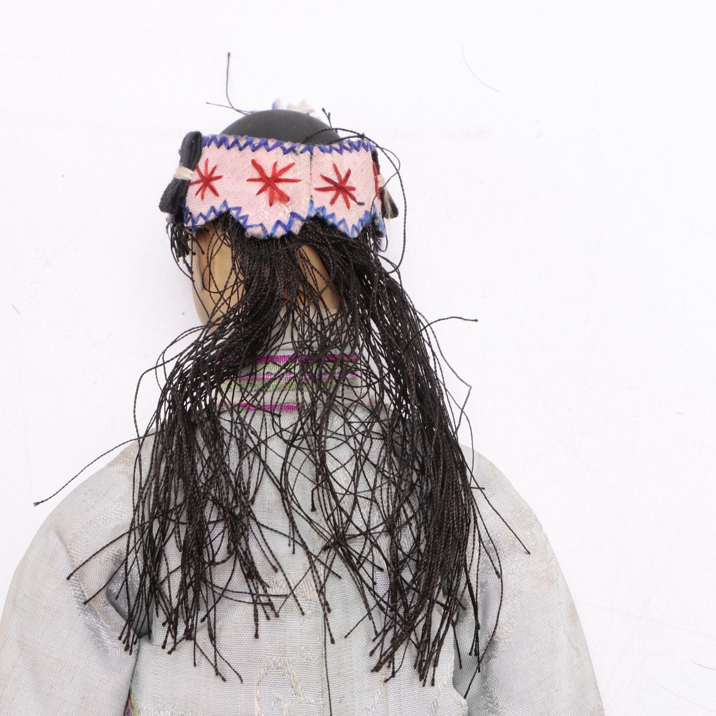 Two Chinese Porcelain Dolls