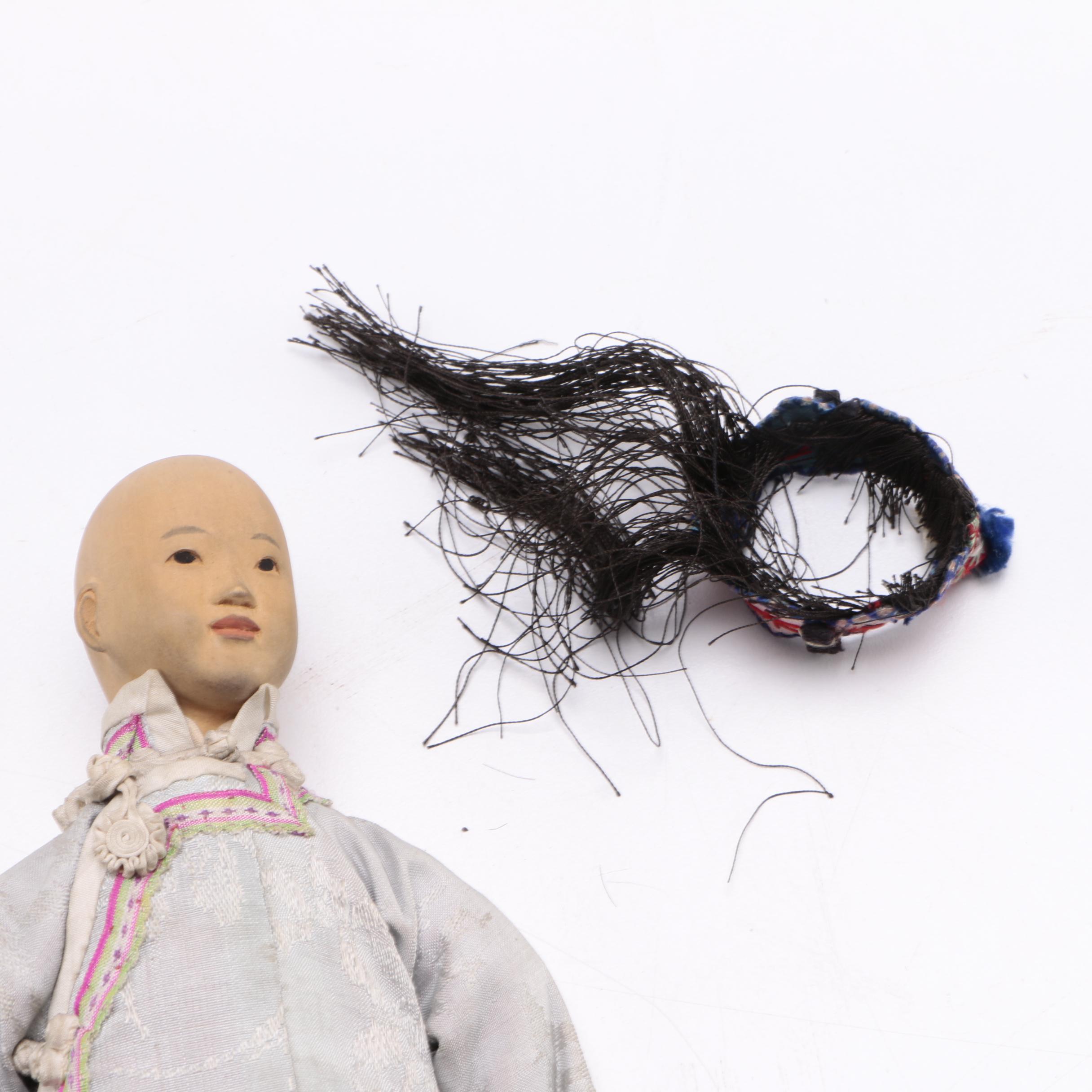 Two Chinese Porcelain Dolls