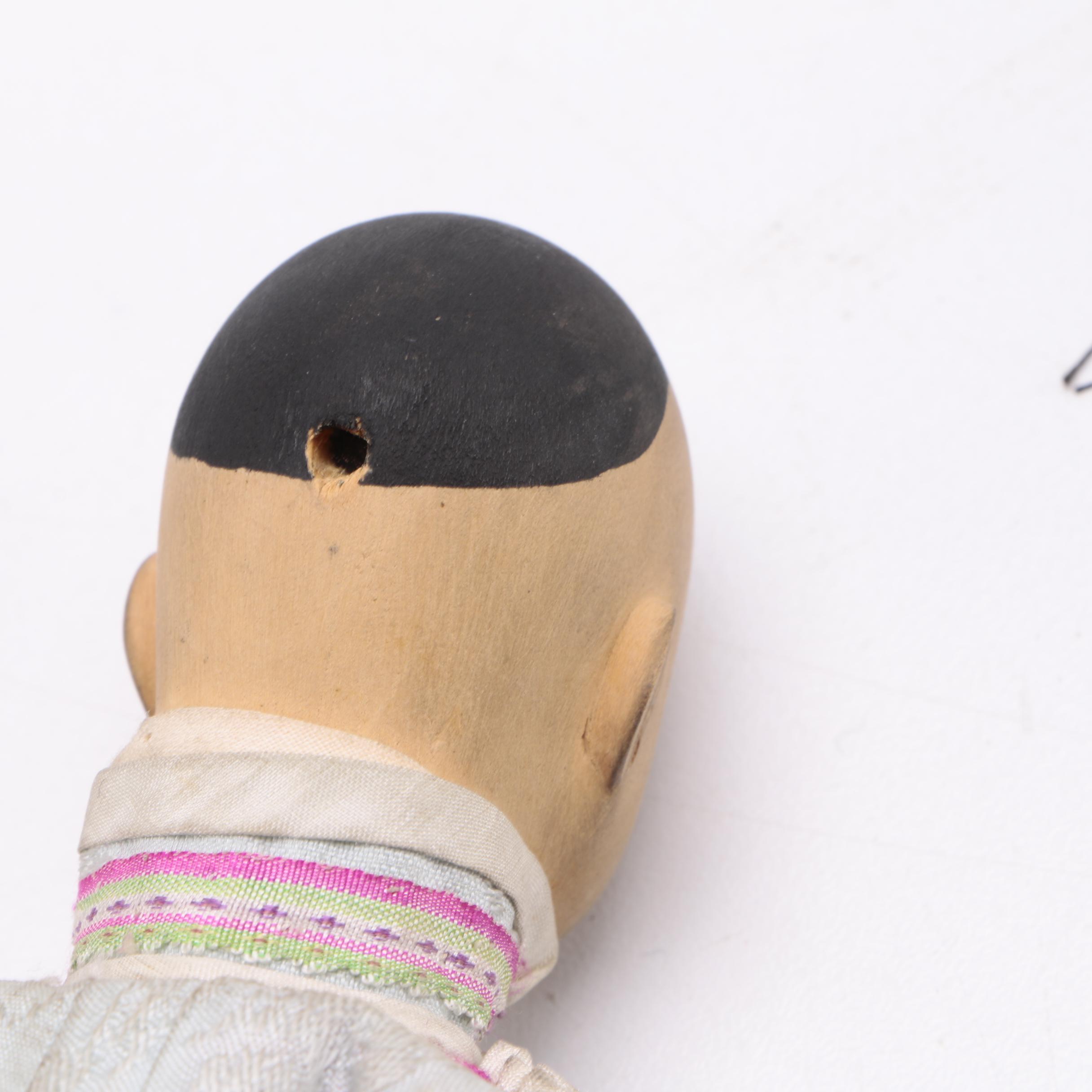 Two Chinese Porcelain Dolls