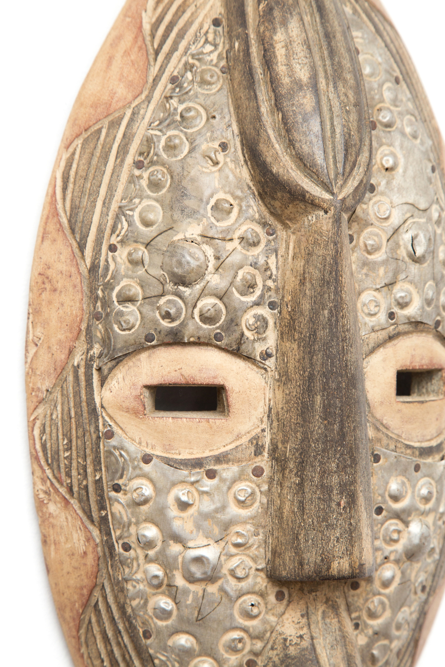Pair Of Hand Carved Tribal Masks With Metal Accents