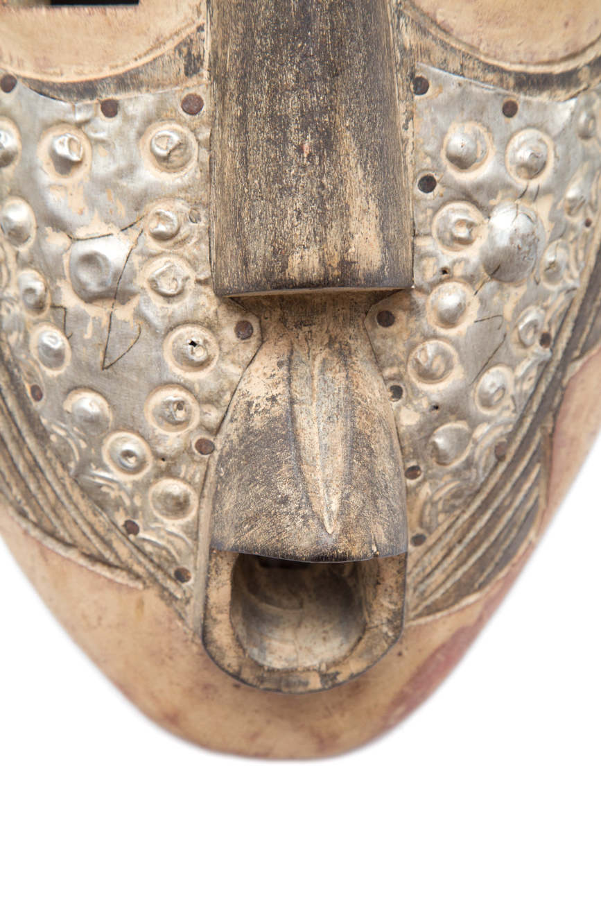 Pair Of Hand Carved Tribal Masks With Metal Accents