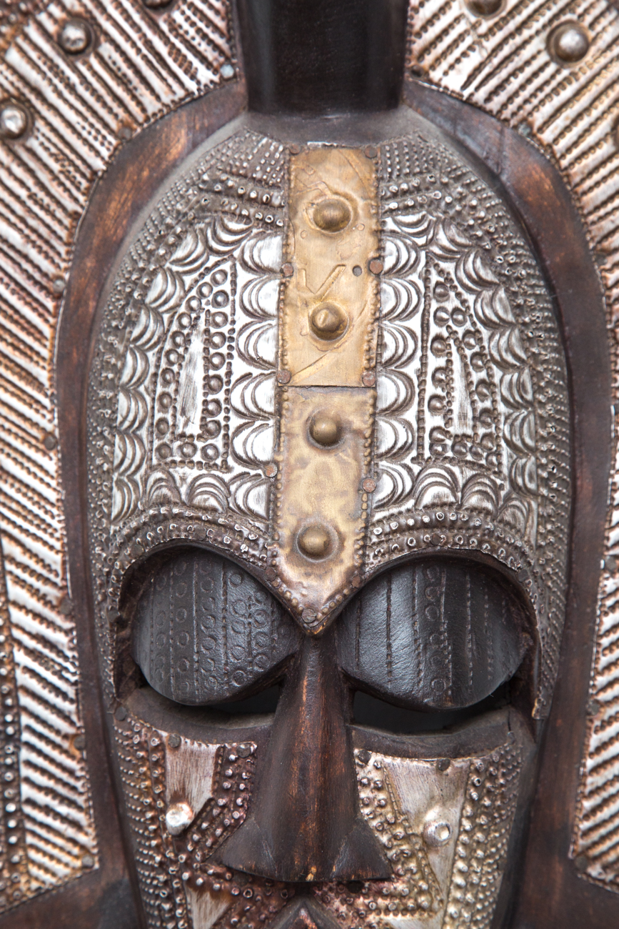 Grouping Of Hand Carved Masks With Hammered Metal Details