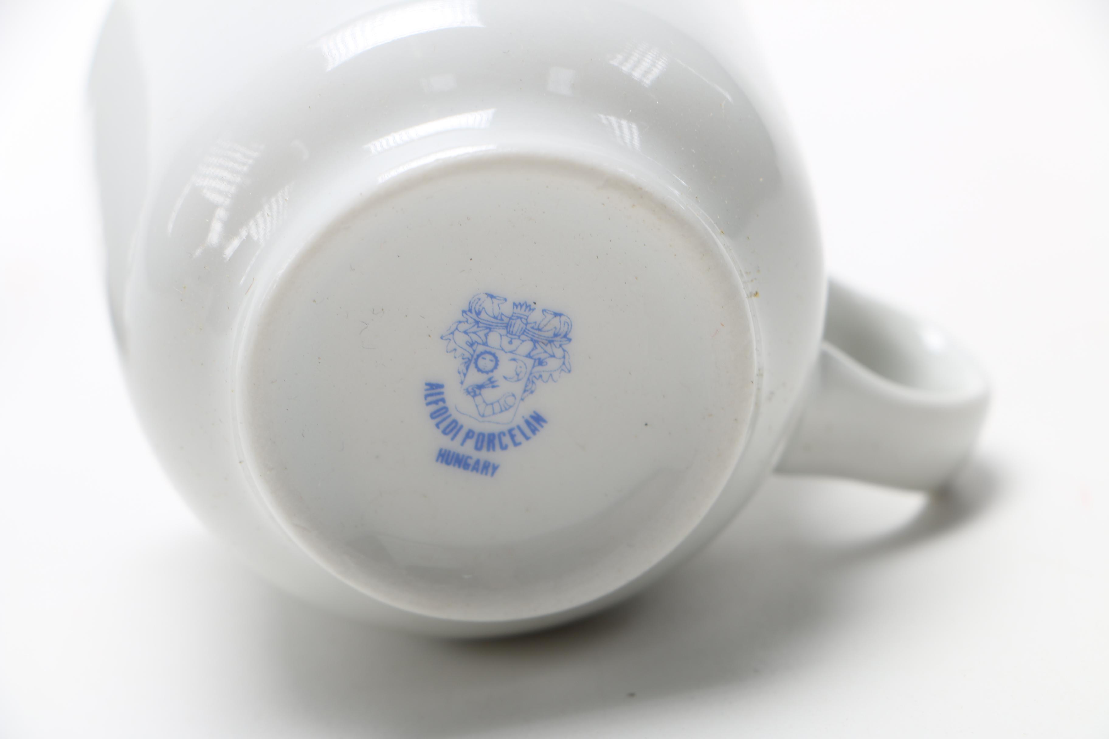 Collection of Porcelain Coffee Cups and Saucers