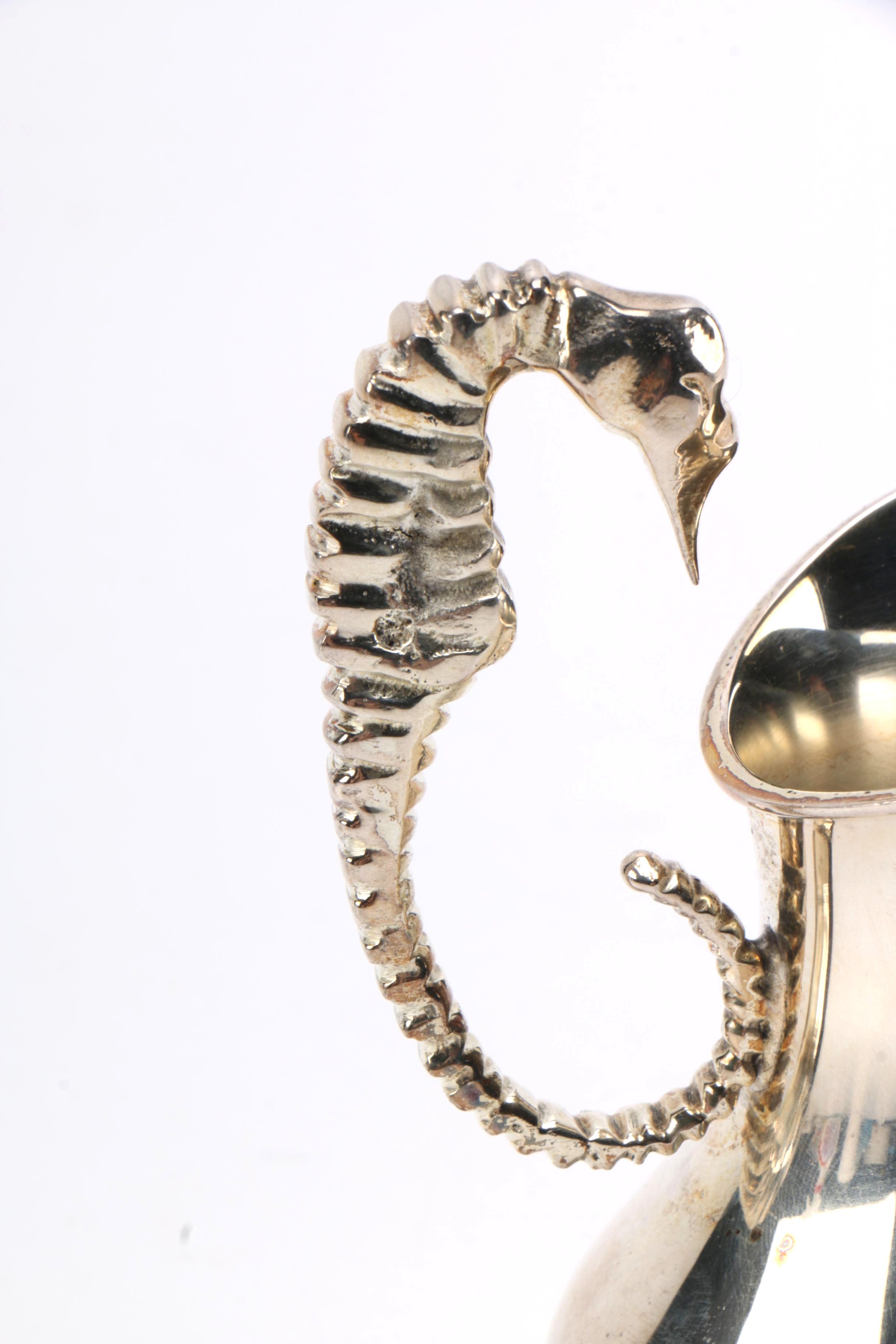 Steel Sea Horse Handled Jugs