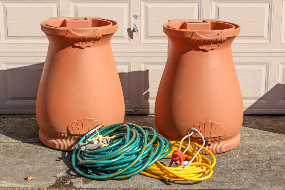Pair of Rain Wizard Urns With Hoses
