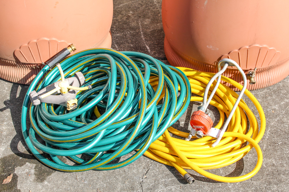 Pair of Rain Wizard Urns With Hoses
