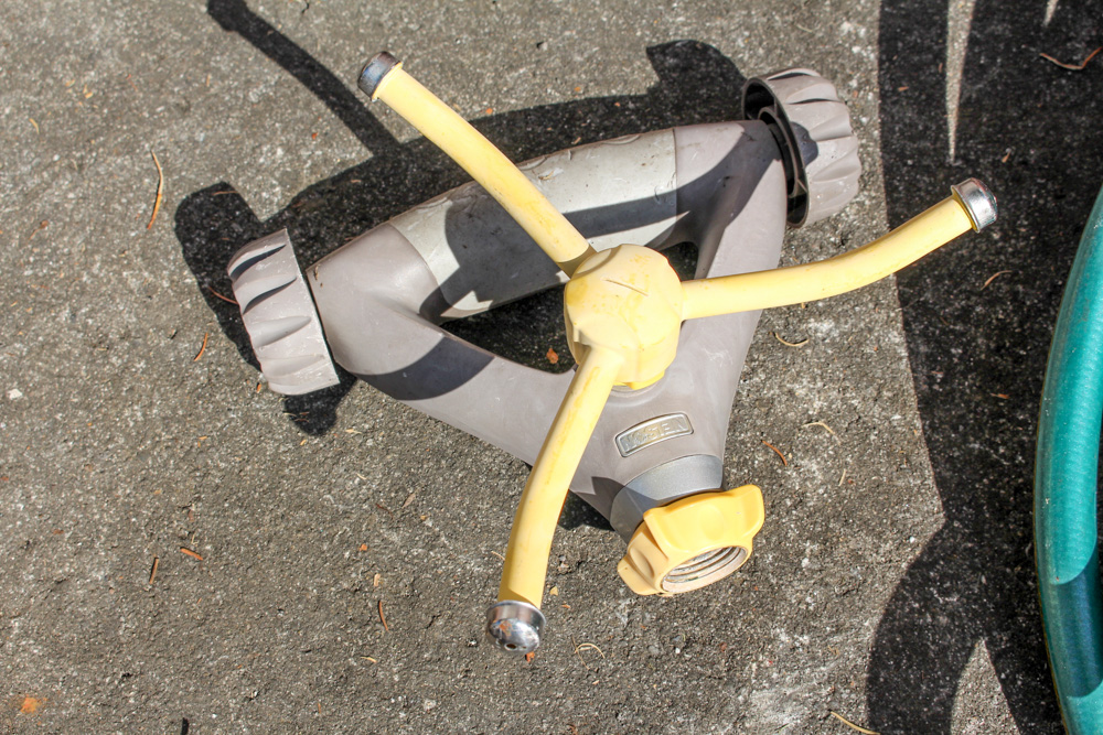 Pair of Rain Wizard Urns With Hoses