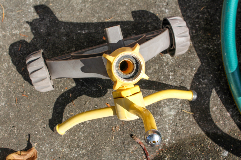 Pair of Rain Wizard Urns With Hoses