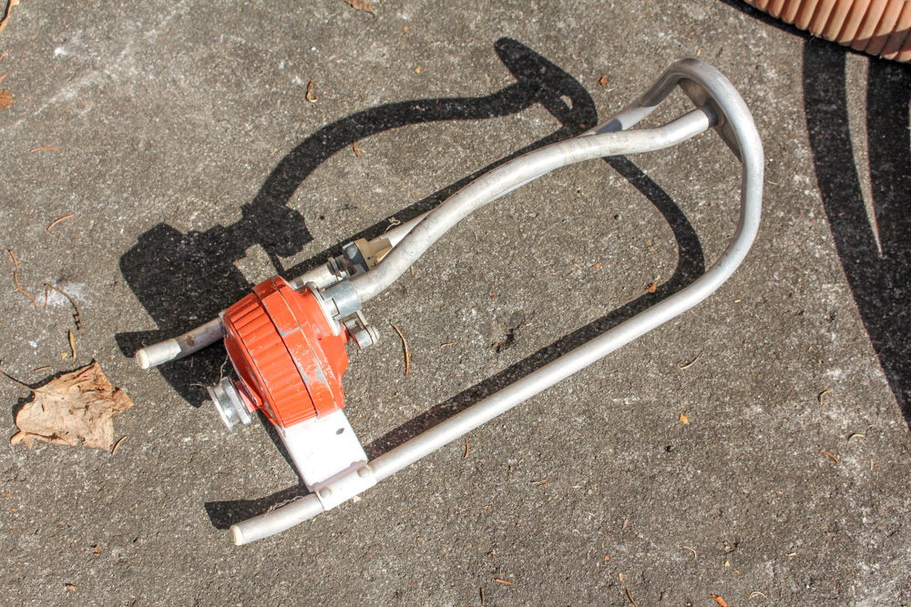 Pair of Rain Wizard Urns With Hoses