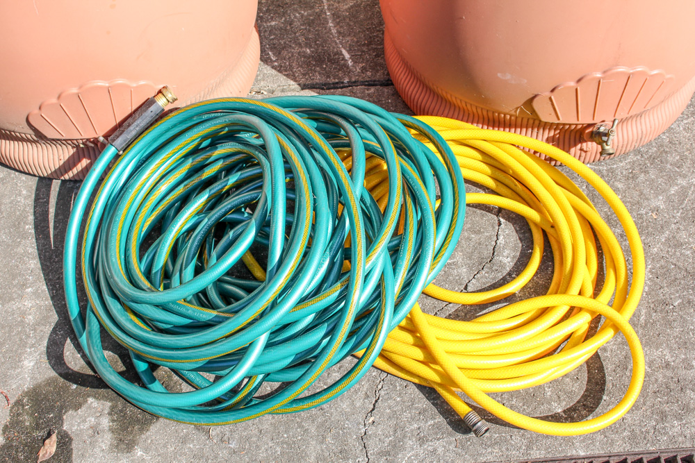 Pair of Rain Wizard Urns With Hoses