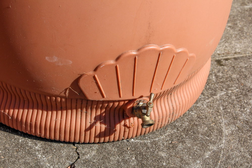 Pair of Rain Wizard Urns With Hoses